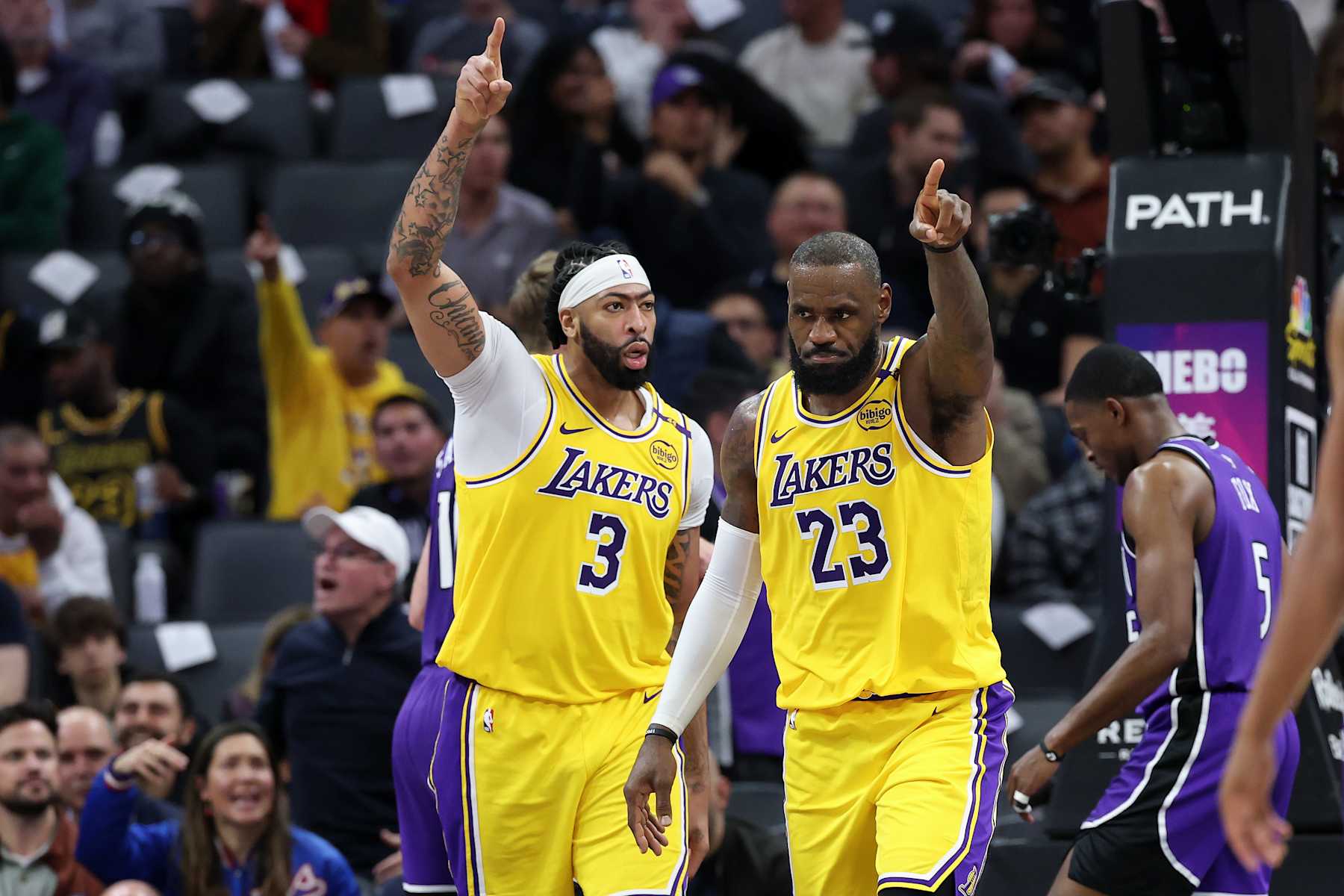 SACRAMENTO, CALIFORNIA - DECEMBER 19: Anthony Davis #3 and LeBron James #23 of the Los Angeles Lakers point down court after a turnover in their game against the Sacramento Kings in the second half at Golden 1 Center on December 19, 2024 in Sacramento, California. NOTE TO USER: User expressly acknowledges and agrees that, by downloading and/or using this photograph, user is consenting to the terms and conditions of the Getty Images License Agreement.   (Photo by Ezra Shaw/Getty Images)