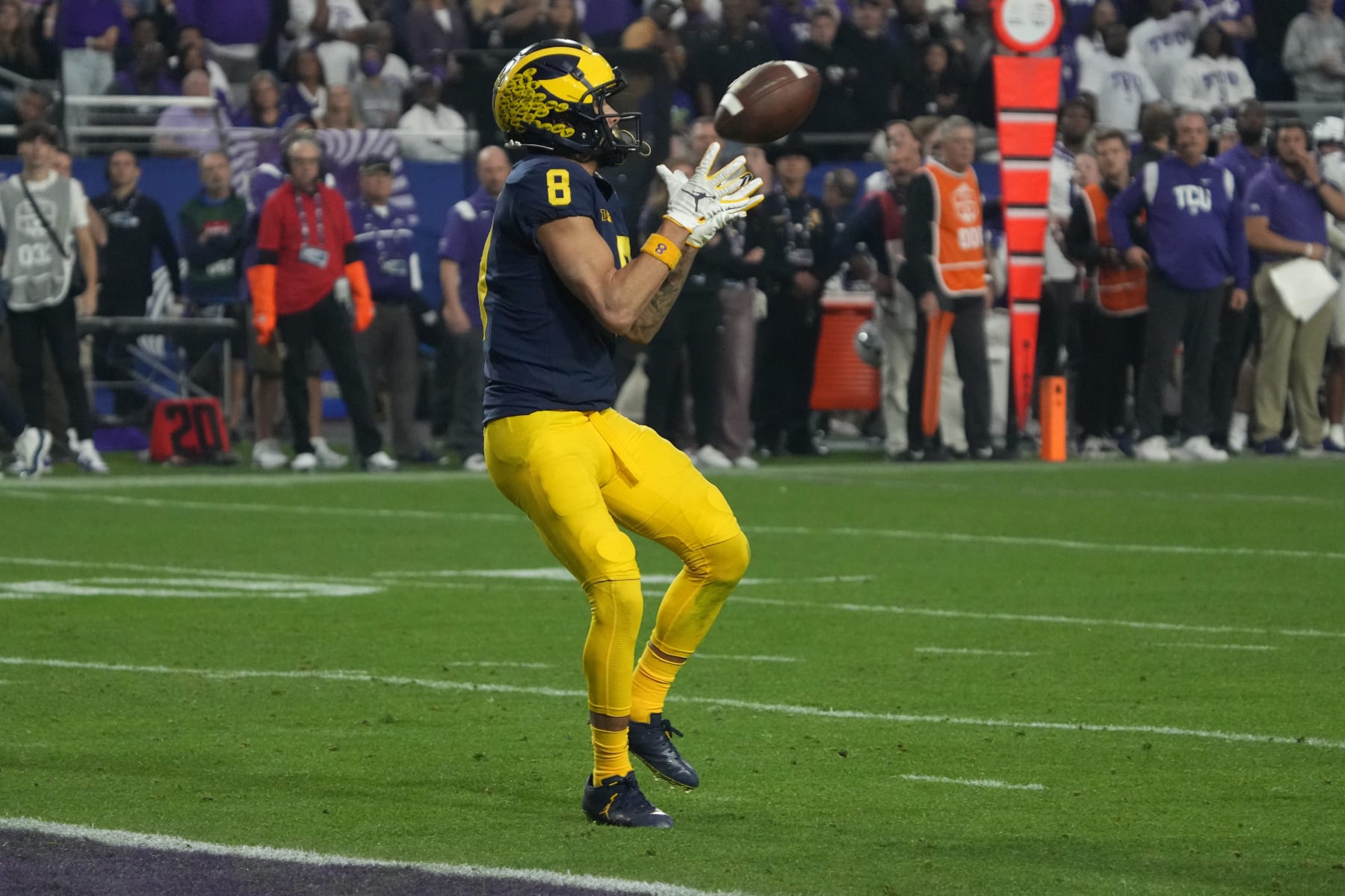 Michigan wide receiver Ronnie Bell (8) makes a touchdown catch against TCU during the second half of the Fiesta Bowl NCAA college football semifinal playoff game, Saturday, Dec. 31, 2022, in Glendale, Ariz. (AP Photo/Rick Scuteri)