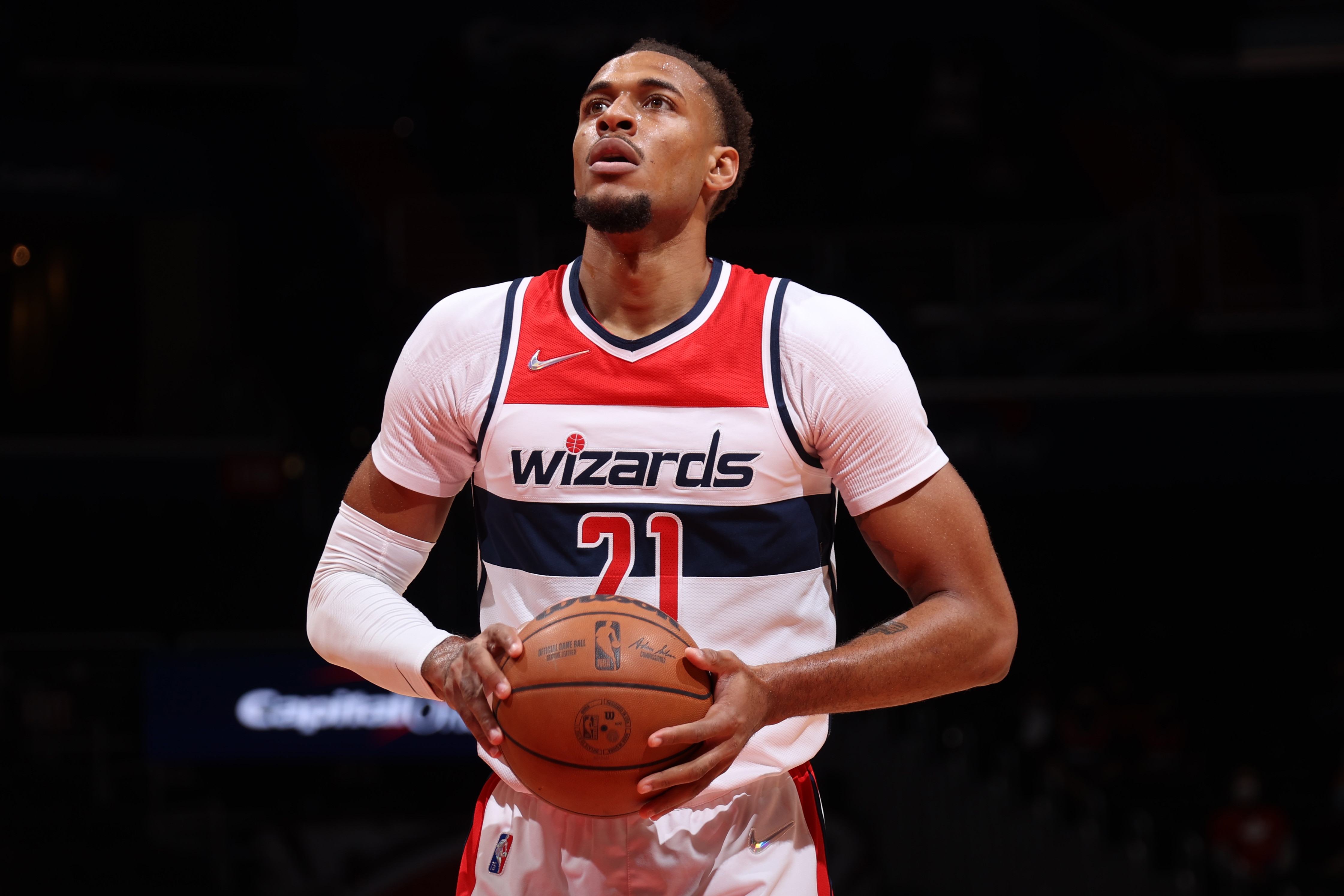 WASHINGTON, DC -  OCTOBER 12: Daniel Gafford #21 of the Washington Wizards shoots a free throw during a preseason game against the Toronto Raptors on October 12, 2021 at Capital One Arena in Washington, DC. NOTE TO USER: User expressly acknowledges and agrees that, by downloading and or using this Photograph, user is consenting to the terms and conditions of the Getty Images License Agreement. Mandatory Copyright Notice: Copyright 2021 NBAE (Photo by Stephen Gosling/NBAE via Getty Images)
