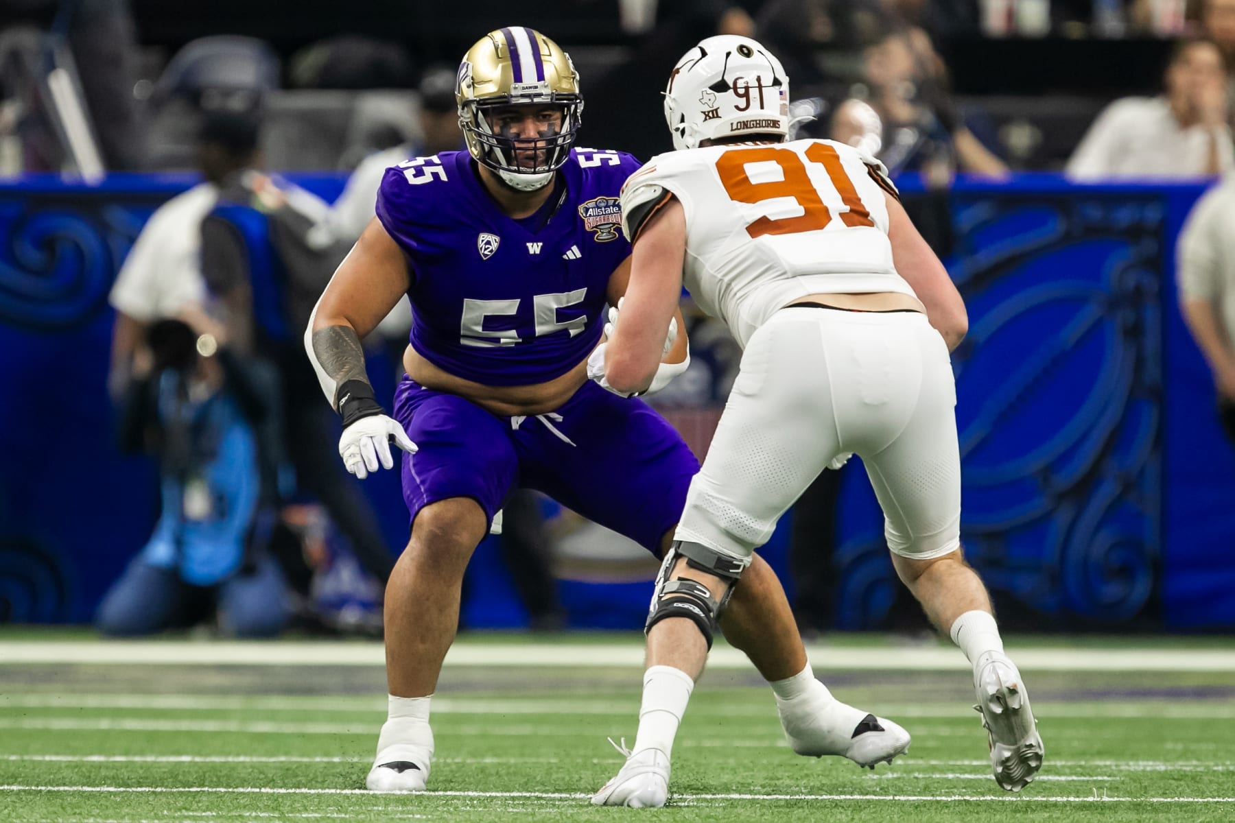 NEW ORLEANS, LA - JANUARY 01: Washington offensive lineman Troy Fautanu (55) prepares to block and opponent during the Allstate Sugar Bowl playoff game between the Texas Longhorns and the Washington Huskies on Monday, January 1, 2024 at Caesars Superdome in New Orleans, LA.  (Photo by Nick Tre. Smith/Icon Sportswire via Getty Images)