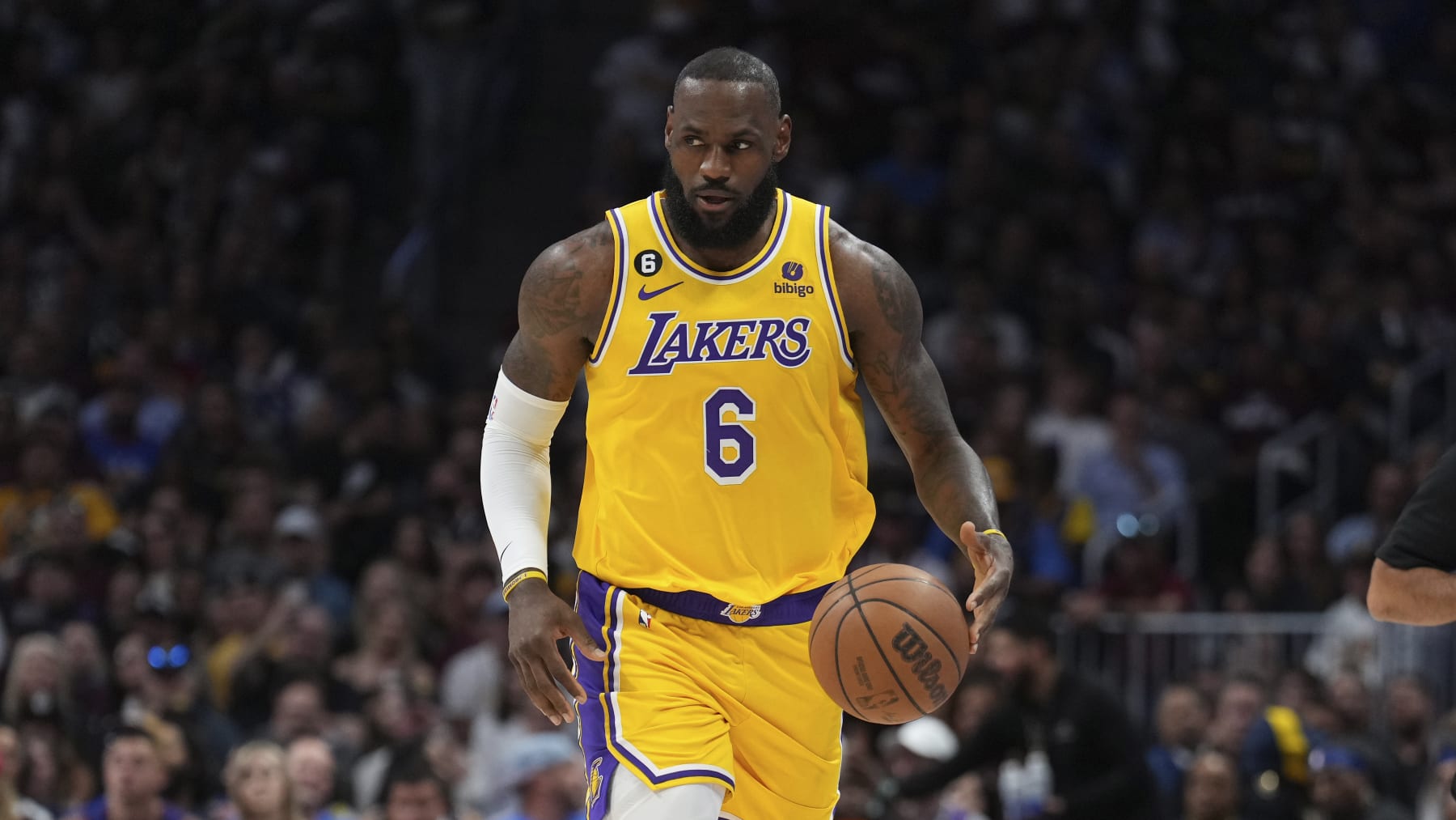 Los Angeles Lakers forward LeBron James (6) moves the ball up court against the Denver Nuggets during the first half of Game 1 of the NBA basketball Western Conference Finals series, Tuesday, May 16, 2023, in Denver. (AP Photo/Jack Dempsey)