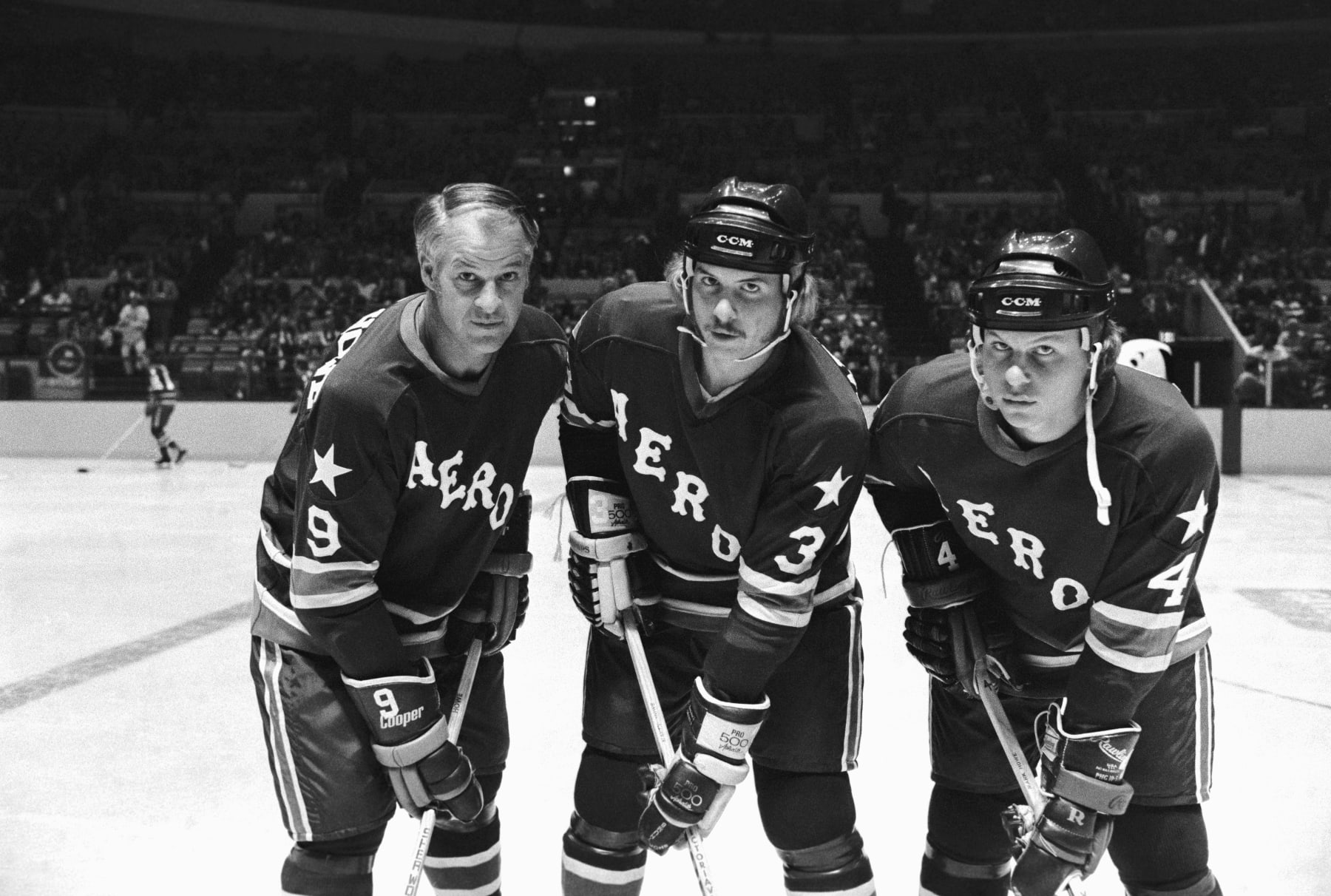 (Original Caption) The three Howes, Father Gordie (left) and sons Marty (center) and Mark take to the ice for the first time in league play here as their team, the Houston Aeros, prepares to meet the New England Whalers for a 15-minute period, part of a four-team hockey spectacular staged by the WHA.