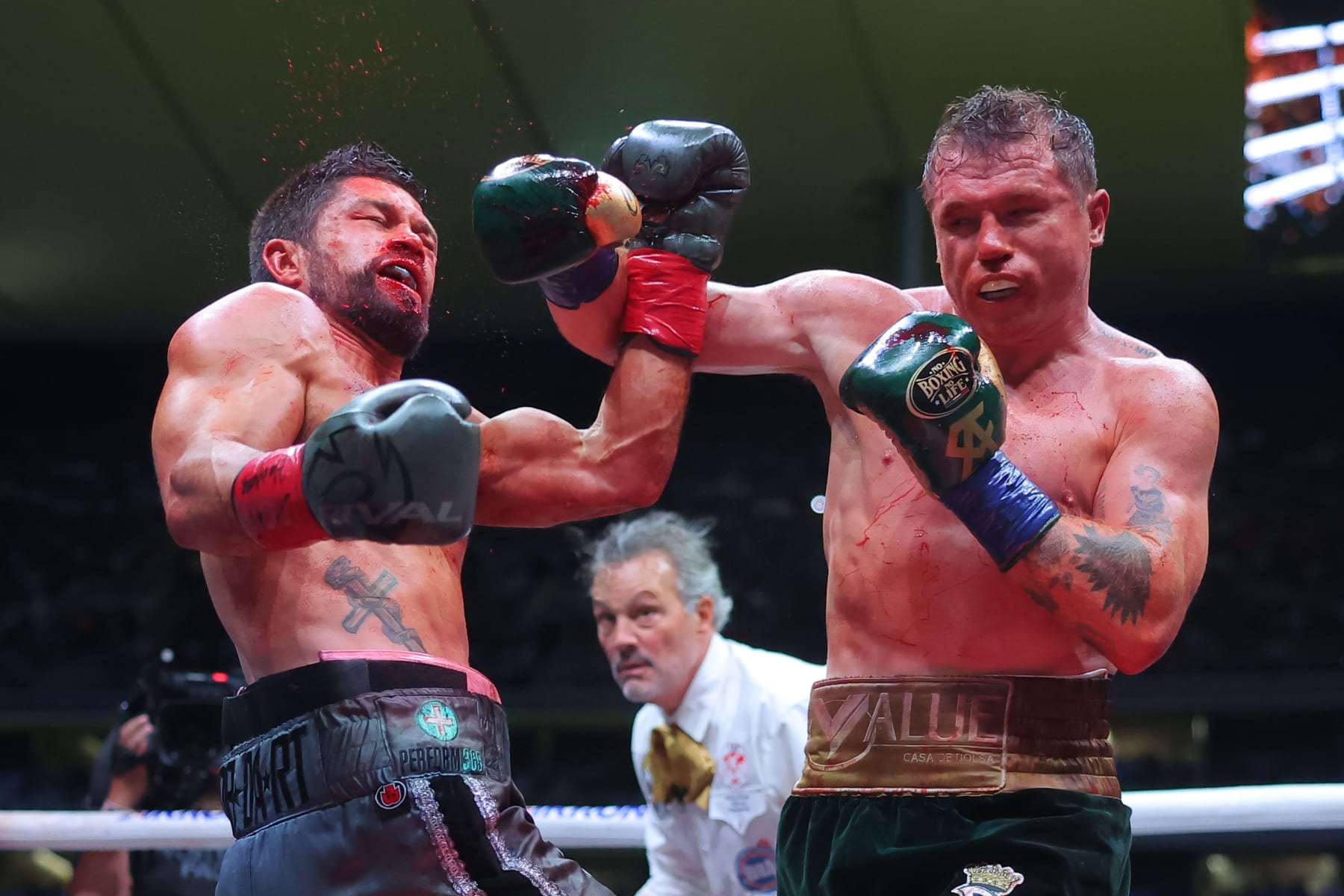 ZAPOPAN, MEXICO - MAY 06: Canelo Alvarez of Mexico punches John Ryder of Great Britain during the fight for the Super Middleweight Championship at Akron Stadium on May 06, 2023 in Zapopan, Mexico. (Photo by Hector Vivas/Getty Images)
