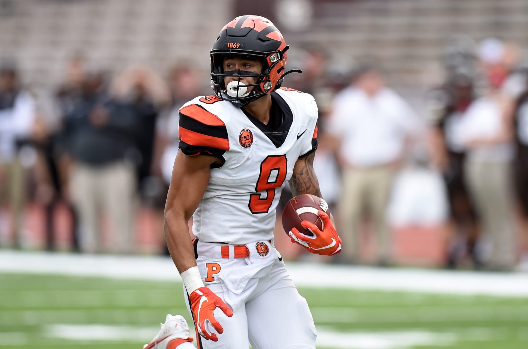 PROVIDENCE, RI - OCTOBER 16:  Andrei Iosivas #9 of the Princeton Tigers runs for a touchtown after making a catch against the Brown Bears at Brown Stadium on October 16, 2021 in Providence, Rhode Island.  (Photo by G Fiume/Getty Images)