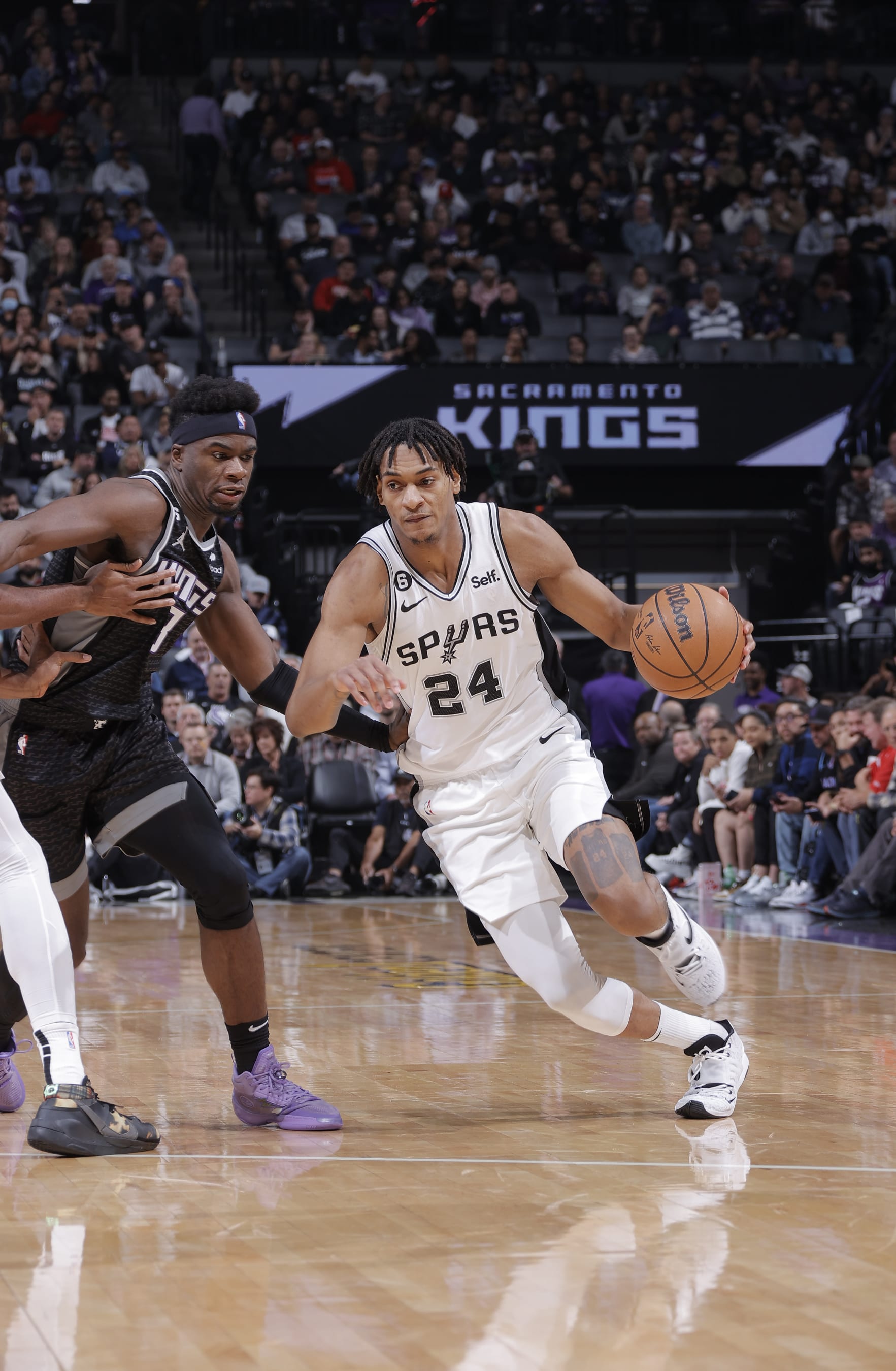 SACRAMENTO, CA - NOVEMBER 17: Devin Vassell #24 of the San Antonio Spurs dribbles the ball during the game against the Sacramento Kings on November 17, 2022 at Golden 1 Center in Sacramento, California. NOTE TO USER: User expressly acknowledges and agrees that, by downloading and or using this photograph, User is consenting to the terms and conditions of the Getty Images Agreement. Mandatory Copyright Notice: Copyright 2022 NBAE (Photo by Rocky Widner/NBAE via Getty Images)