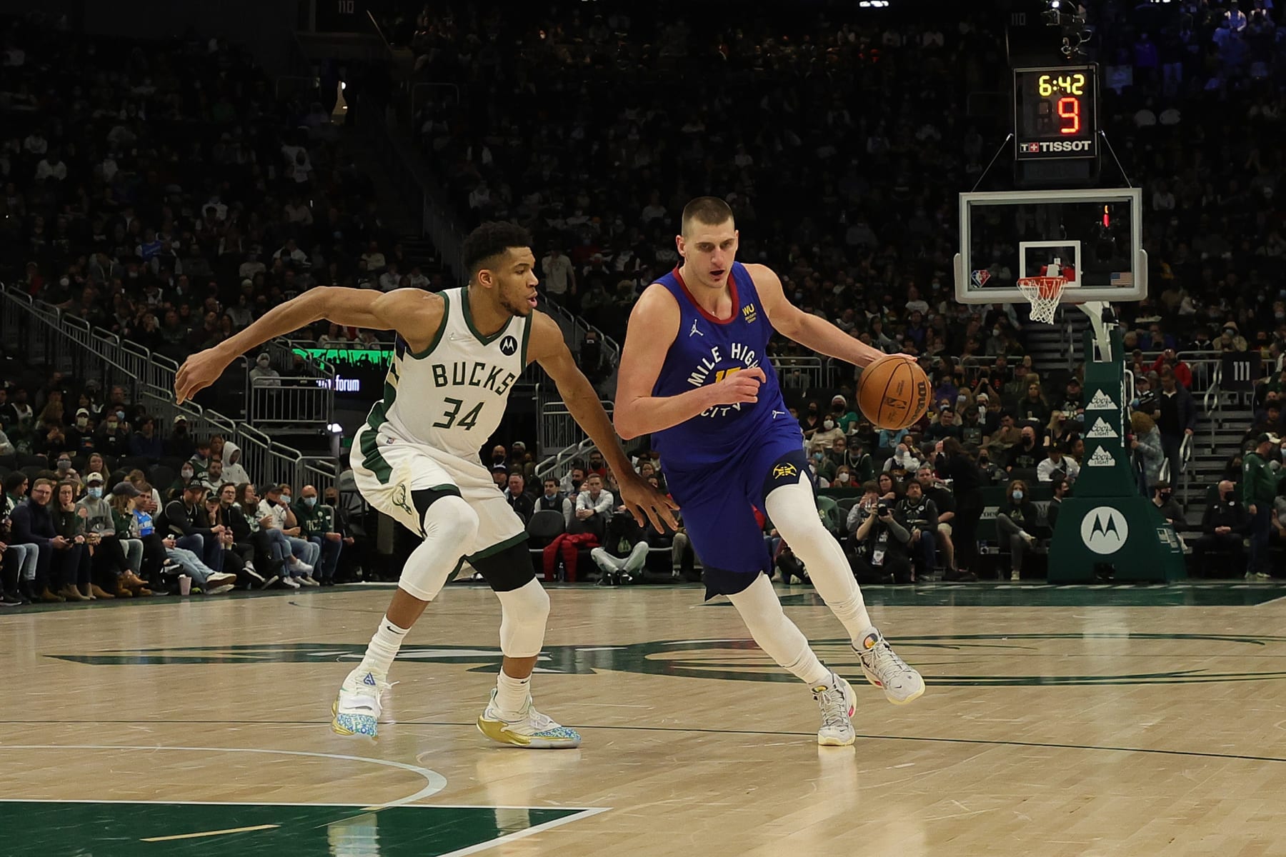 MILWAUKEE, WISCONSIN - JANUARY 30: Nikola Jokic #15 of the Denver Nuggets is defended by Giannis Antetokounmpo #34 of the Milwaukee Bucks during a game at Fiserv Forum on January 30, 2022 in Milwaukee, Wisconsin. NOTE TO USER: User expressly acknowledges and agrees that, by downloading and or using this photograph, User is consenting to the terms and conditions of the Getty Images License Agreement. (Photo by Stacy Revere/Getty Images)