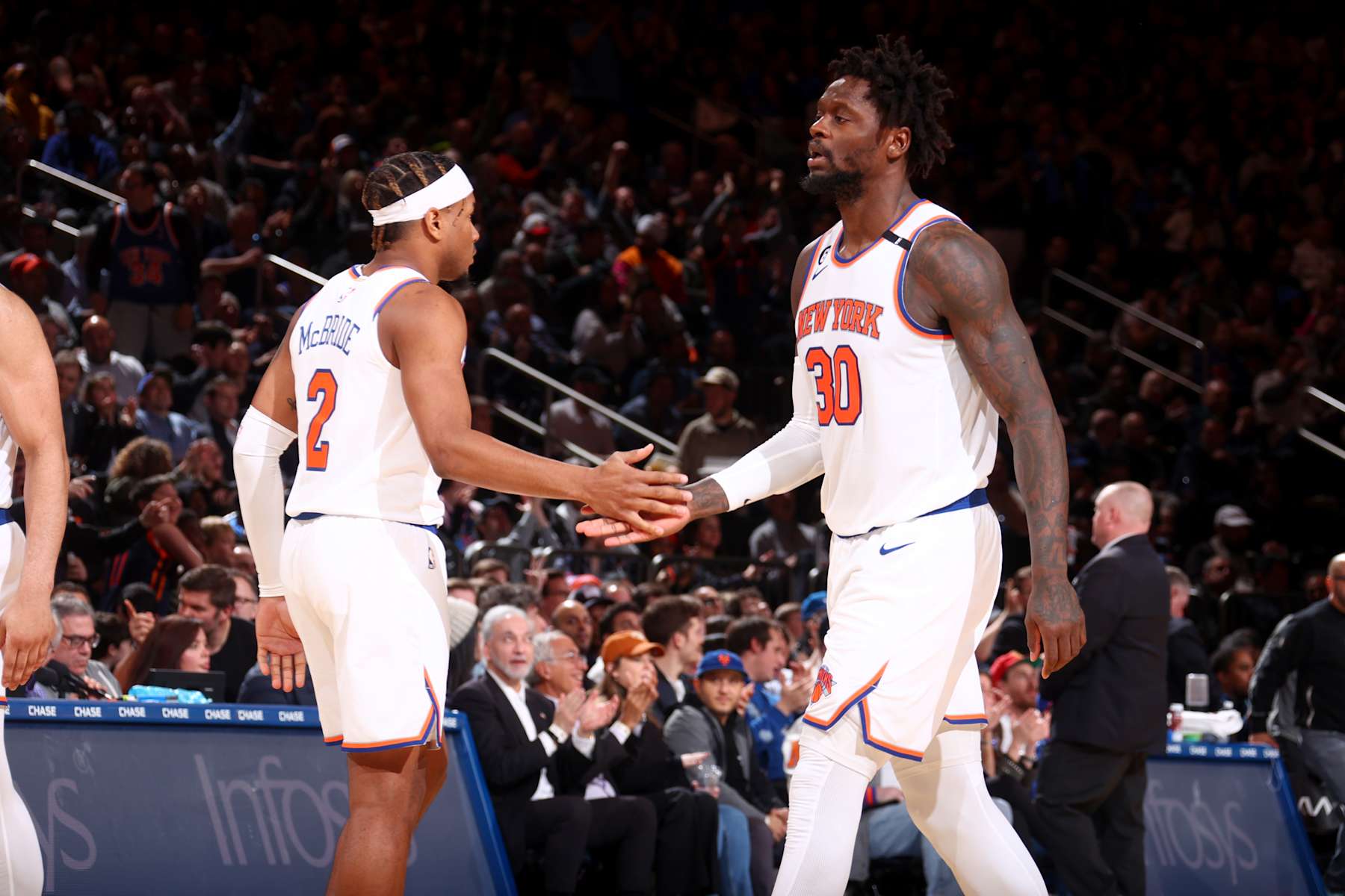NEW YORK, NY - MARCH 27: Julius Randle #30 of the New York Knicks high fives Miles McBride #2 of the New York Knicks during the game against the Houston Rockets on March 27, 2023 at Madison Square Garden in New York City, New York.  NOTE TO USER: User expressly acknowledges and agrees that, by downloading and or using this photograph, User is consenting to the terms and conditions of the Getty Images License Agreement. Mandatory Copyright Notice: Copyright 2023 NBAE  (Photo by Nathaniel S. Butler/NBAE via Getty Images)
