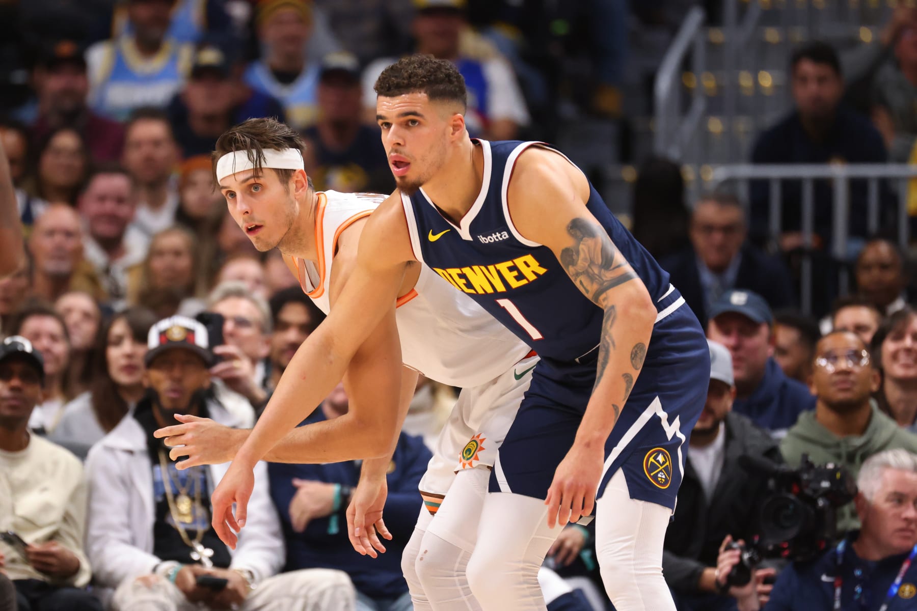 DENVER, COLORADO - NOVEMBER 26: Zach Collins #23 of the San Antonio Spurs and Michael Porter Jr. #1 of the Denver Nuggets set to rebound a foul shot in the first half at Ball Arena on November 26, 2023 in Denver, Colorado. NOTE TO USER: User expressly acknowledges and agrees that, by downloading and/or using this Photograph, user is consenting to the terms and conditions of the Getty Images License Agreement. (Photo by Justin Tafoya/Getty Images)