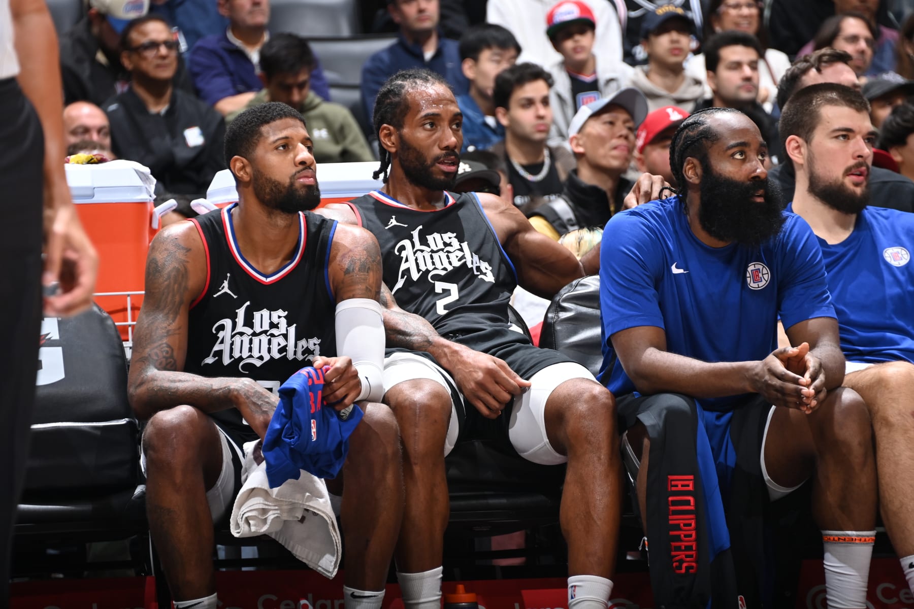 LOS ANGELES, CA - NOVEMBER 25: Paul George #13 of the LA Clippers, Kawhi Leonard #2 of the LA Clippers and James Harden #1 of the LA Clippers look on during the game against the Dallas Mavericks on November 25, 2023 at Crypto.Com Arena in Los Angeles, California. NOTE TO USER: User expressly acknowledges and agrees that, by downloading and/or using this Photograph, user is consenting to the terms and conditions of the Getty Images License Agreement. Mandatory Copyright Notice: Copyright 2023 NBAE (Photo by Andrew D. Bernstein/NBAE via Getty Images)