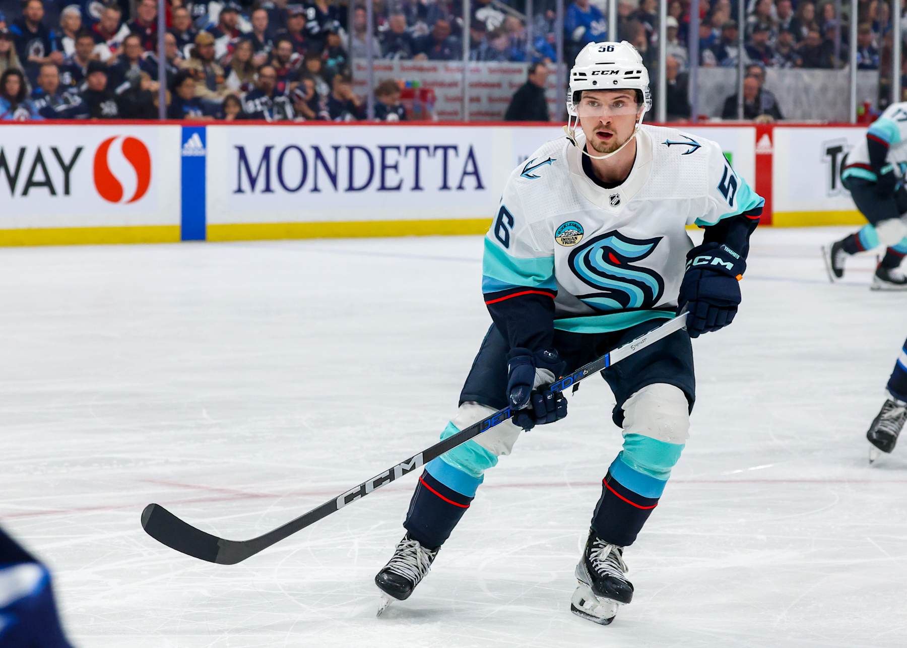 WINNIPEG, CANADA - APRIL 16: Kailer Yamamoto #56 of the Seattle Kraken skates during second period action against the Winnipeg Jets at Canada Life Centre on April 16, 2024 in Winnipeg, Manitoba, Canada. (Photo by Jonathan Kozub/NHLI via Getty Images)