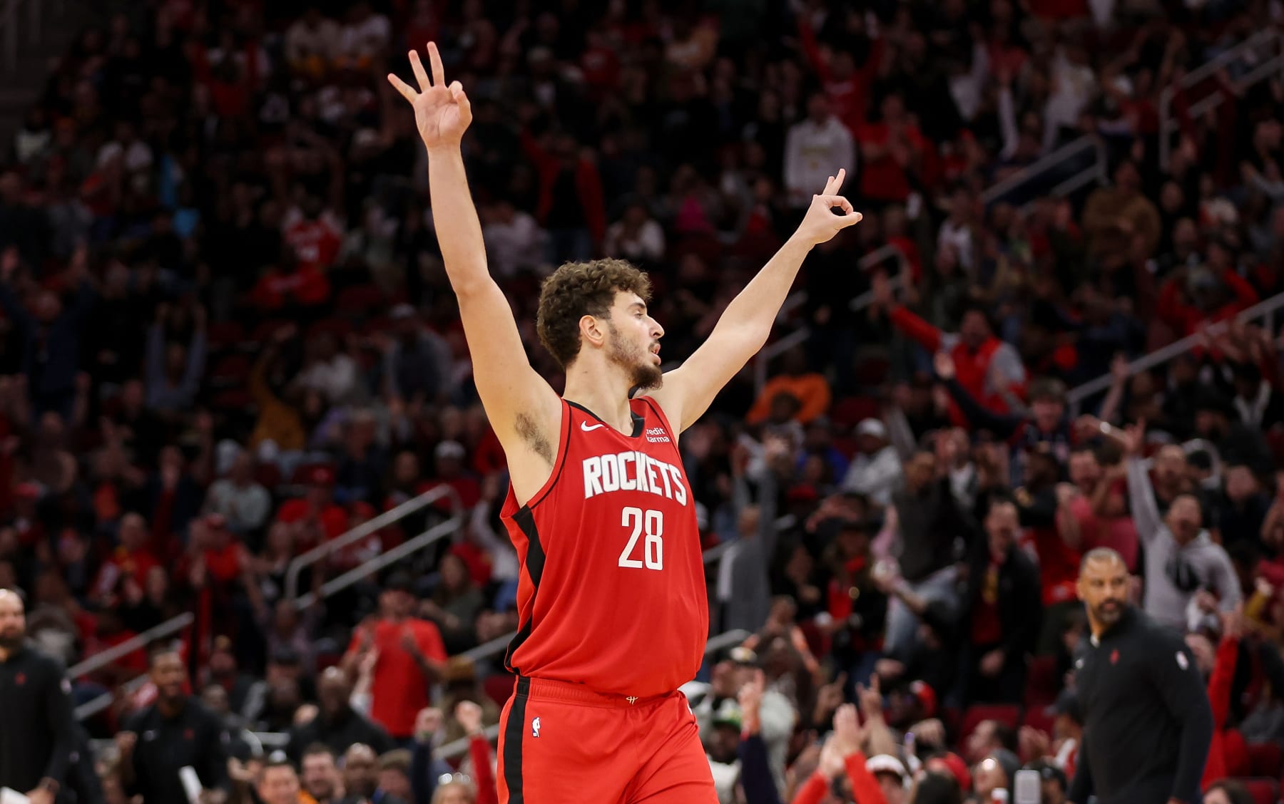 HOUSTON, TEXAS - NOVEMBER 12: Alperen Sengun #28 of the Houston Rockets gestures after a three-point shot in the second half against the Denver Nuggets at Toyota Center on November 12, 2023 in Houston, Texas.  NOTE TO USER: User expressly acknowledges and agrees that, by downloading and or using this photograph, User is consenting to the terms and conditions of the Getty Images License Agreement. (Photo by Tim Warner/Getty Images)
