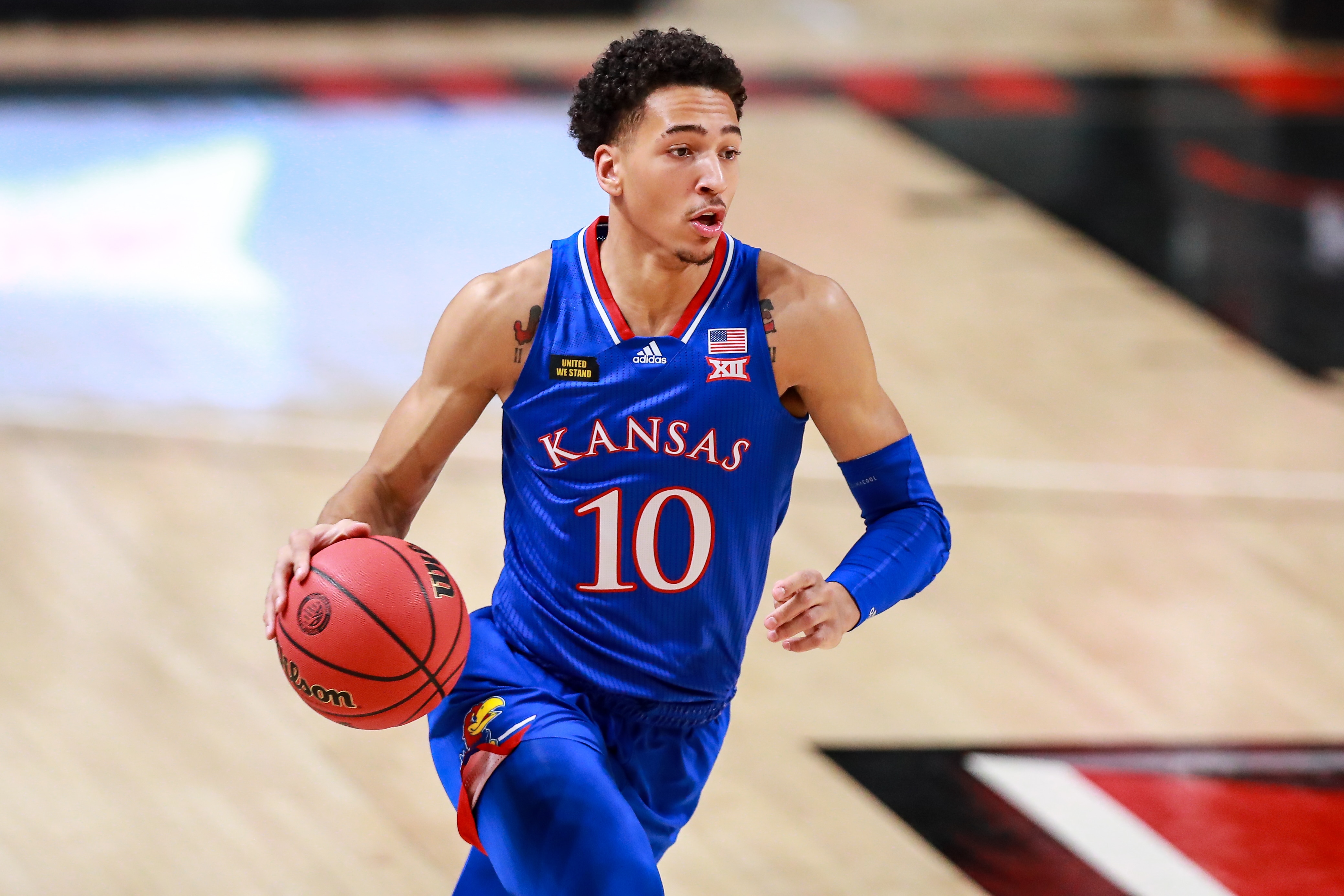 LUBBOCK, TEXAS - DECEMBER 17: Forward Jalen Wilson #10 of the Kansas Jayhawks handles the ball during the first half of the college basketball game against the Texas Tech Red Raiders at United Supermarkets Arena on December 17, 2020 in Lubbock, Texas. (Photo by John E. Moore III/Getty Images)