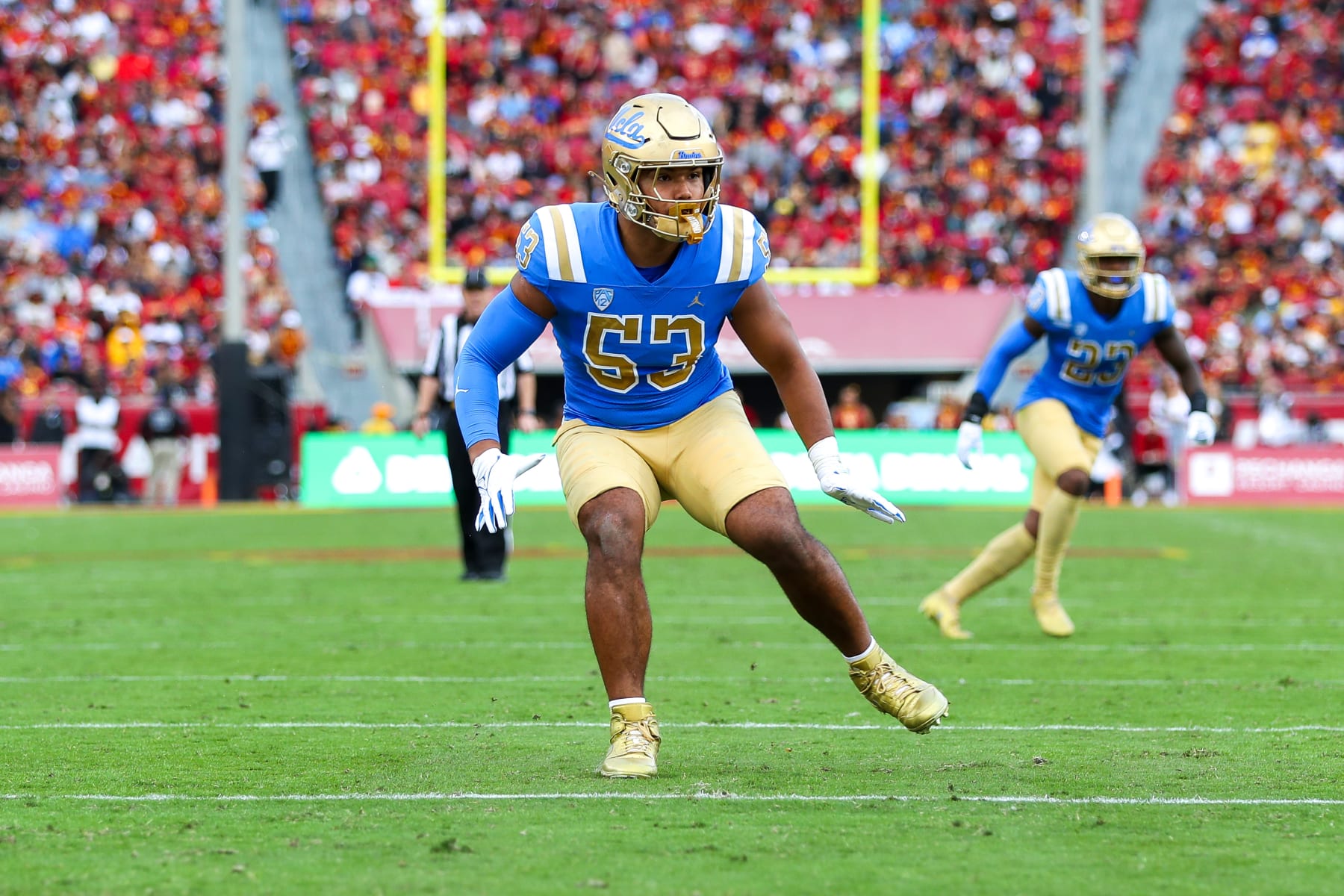 LOS ANGELES, CA - NOVEMBER 18: UCLA Bruins linebacker Darius Muasau (53) drop back into coverage during a college football game between the UCLA Bruins and the USC Trojans on November 18, 2023, at the Los Angeles Memorial Coliseum in Los Angeles, CA. (Photo by Jordon Kelly/Icon Sportswire via Getty Images)