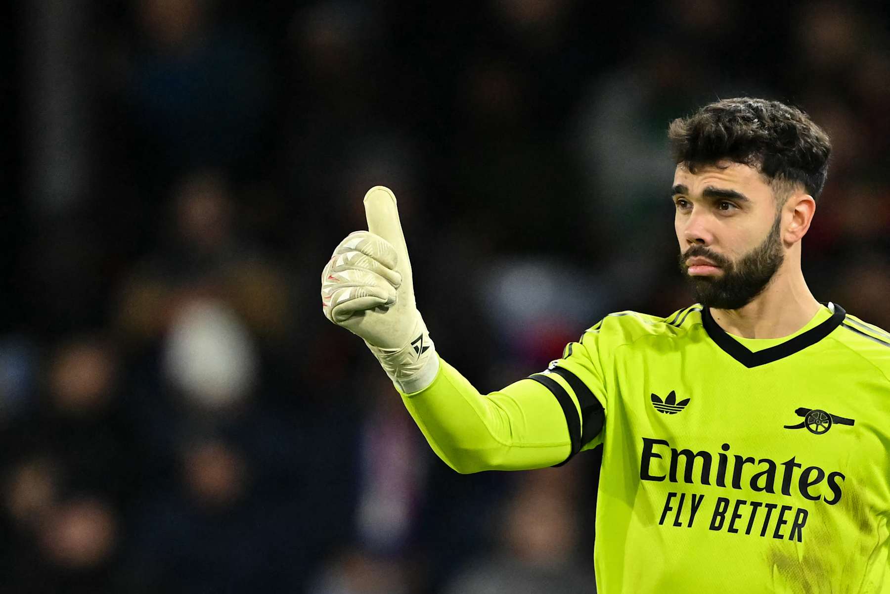 Arsenal's Spanish goalkeeper #22 David Raya does a thumb up  during the English Premier League football match between Crystal Palace and Arsenal at Selhurst Park in south London on December 21, 2024. (Photo by Glyn KIRK / AFP) / RESTRICTED TO EDITORIAL USE. No use with unauthorized audio, video, data, fixture lists, club/league logos or 'live' services. Online in-match use limited to 120 images. An additional 40 images may be used in extra time. No video emulation. Social media in-match use limited to 120 images. An additional 40 images may be used in extra time. No use in betting publications, games or single club/league/player publications. /  (Photo by GLYN KIRK/AFP via Getty Images)