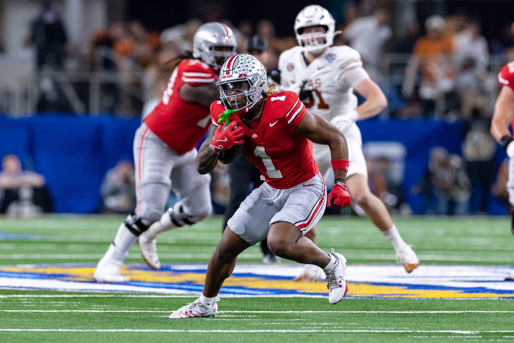 ARLINGTON, TX - JANUARY 10: Ohio State Buckeyes running back Quinshon Judkins (#1) runs up field during the CFP Semifinal Cotton Bowl Classic football game between the Ohio State Buckeyes and Texas Longhorns on January 10, 2025 at AT&T Stadium in Arlington, TX.  (Photo by Matthew Visinsky/Icon Sportswire via Getty Images)