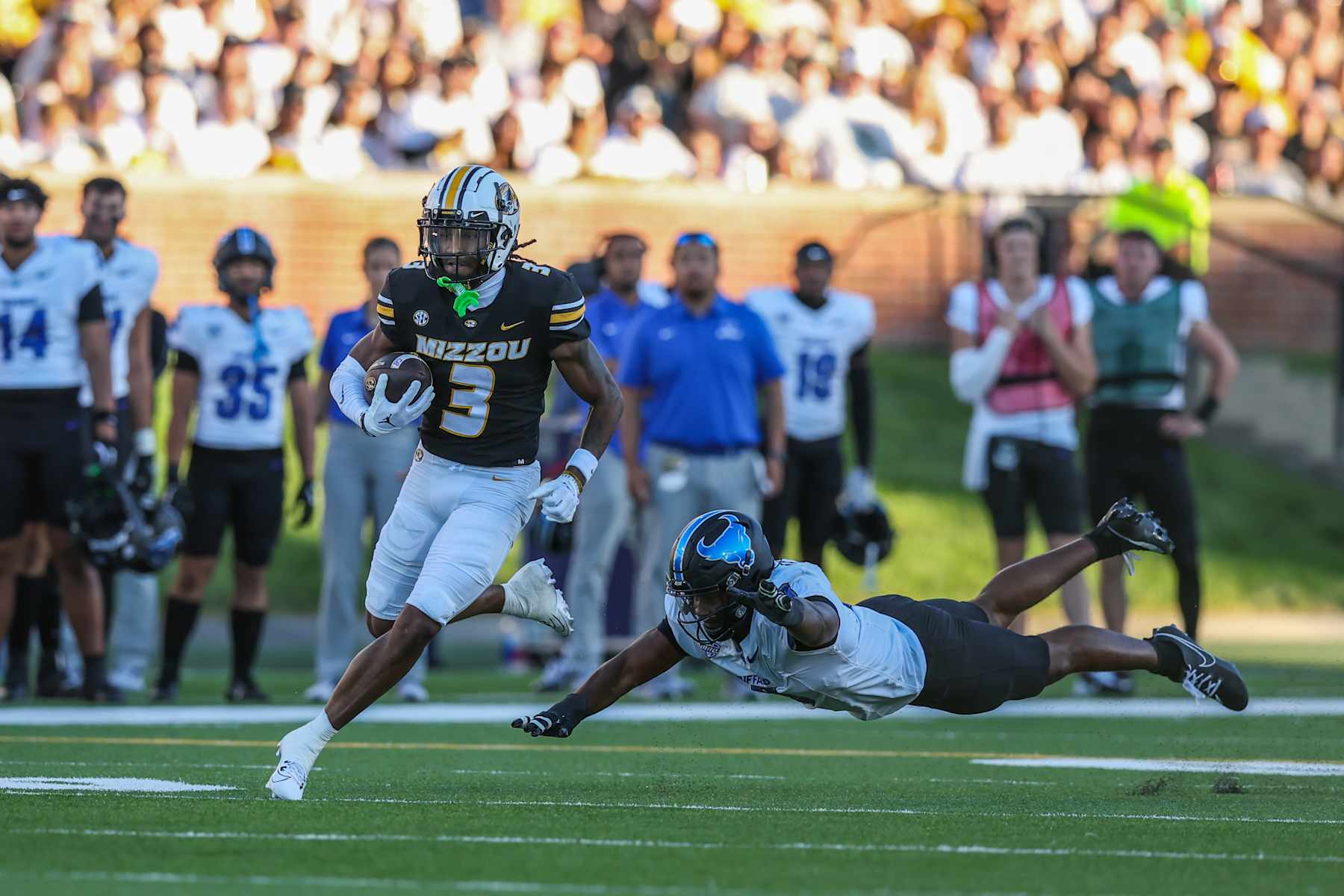 COLUMBIA, MO - SEPTEMBER 07: Missouri Tigers wide receiver Luther Burden III (3) runs past a diving defender in the second quarter of a college football game between the Buffalo Bulls and Missouri Tigers on September 7, 2024 at Memorial Stadium in Columbia, MO. (Photo by Scott Winters/Icon Sportswire via Getty Images)
