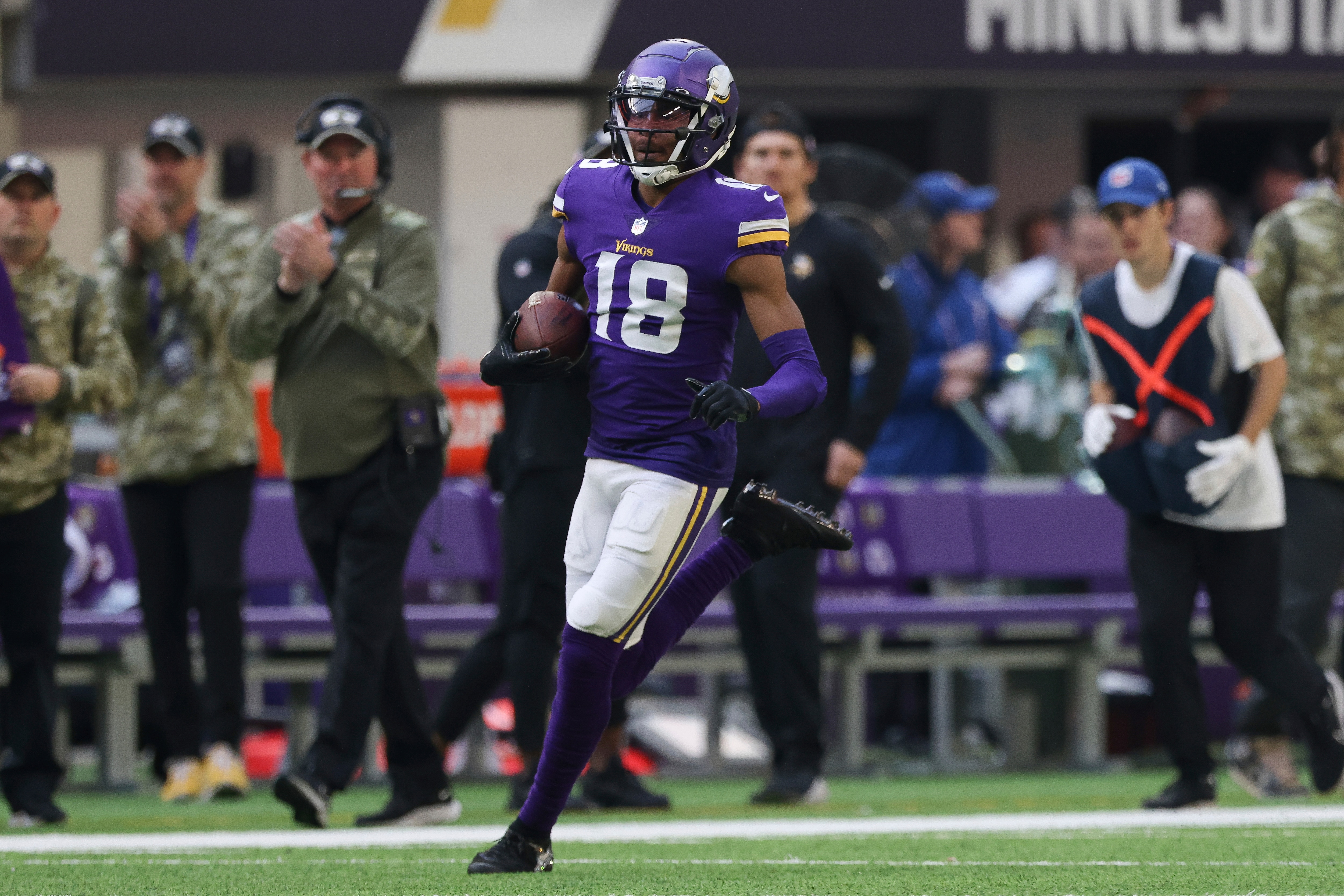 Minnesota Vikings wide receiver Justin Jefferson (18) carries the ball during the first half of an NFL football game, against the Green Bay Packers, Sunday, Nov. 21, 2021 in Minneapolis. Minnesota won 34-31. (AP Photo/Stacy Bengs)