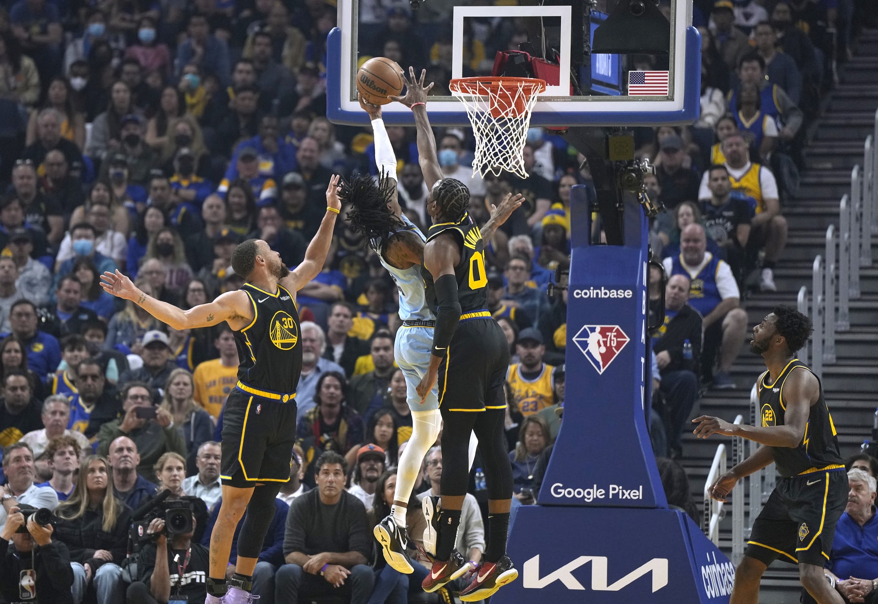 SAN FRANCISCO, CALIFORNIA - MAY 07: Ja Morant #12 of the Memphis Grizzlies drives to the basket and shoots over Stephen Curry #30 and Jonathan Kuminga #00 of the Golden State Warriors during the first half of Game Three of the Western Conference Semifinals of the NBA Playoffs at Chase Center on May 07, 2022 in San Francisco, California. NOTE TO USER: User expressly acknowledges and agrees that, by downloading and or using this photograph, User is consenting to the terms and conditions of the Getty Images License Agreement. (Photo by Thearon W. Henderson/Getty Images)