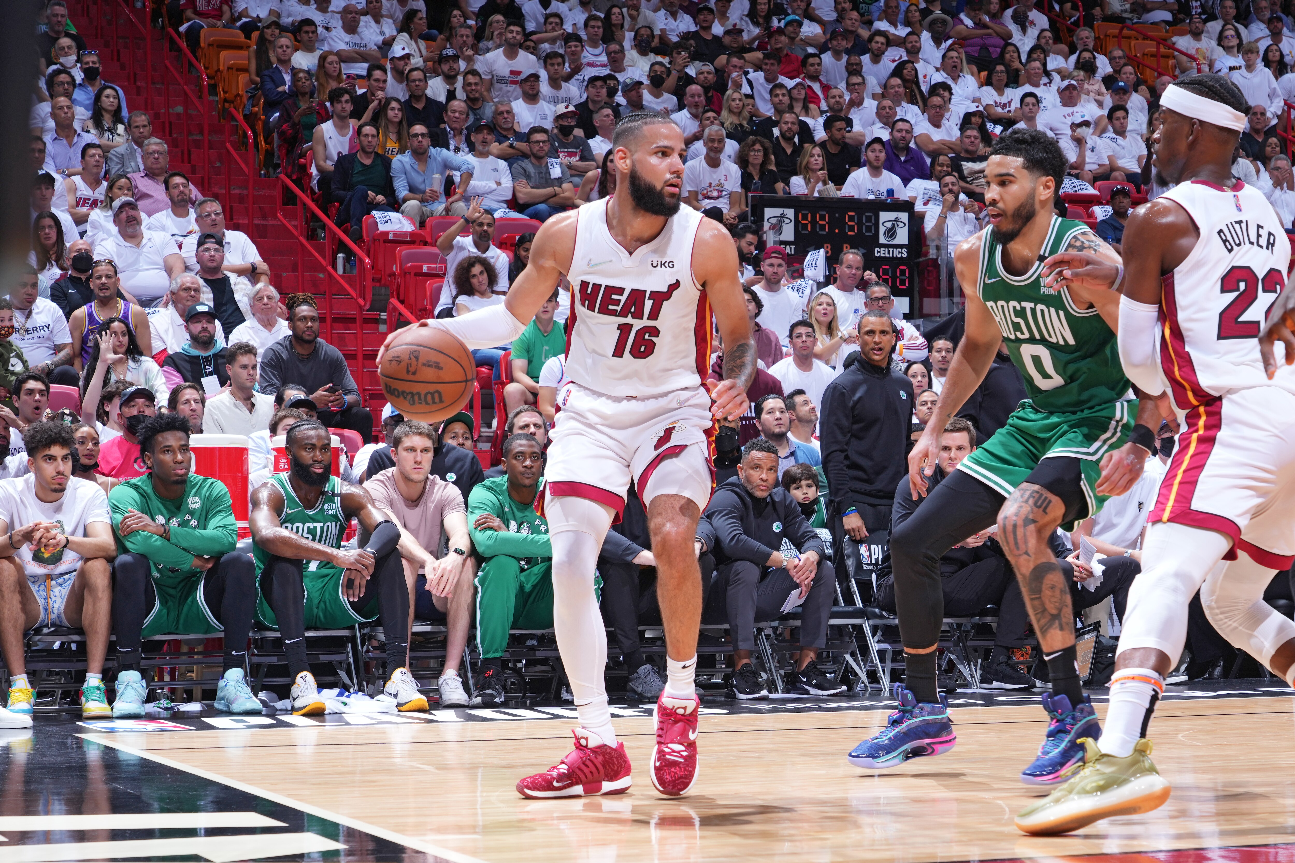 MIAMI, FL - MAY 17: Caleb Martin #16 of the Miami Heat handles the ball against the Boston Celtics during Game 1 of the 2022 NBA Playoffs Eastern Conference Finals on May 17, 2022 at The FTX Arena in Miami, Florida. NOTE TO USER: User expressly acknowledges and agrees that, by downloading and/or using this Photograph, user is consenting to the terms and conditions of the Getty Images License Agreement. Mandatory Copyright Notice: Copyright 2022 NBAE (Photo by Jesse D. Garrabrant/NBAE via Getty Images)