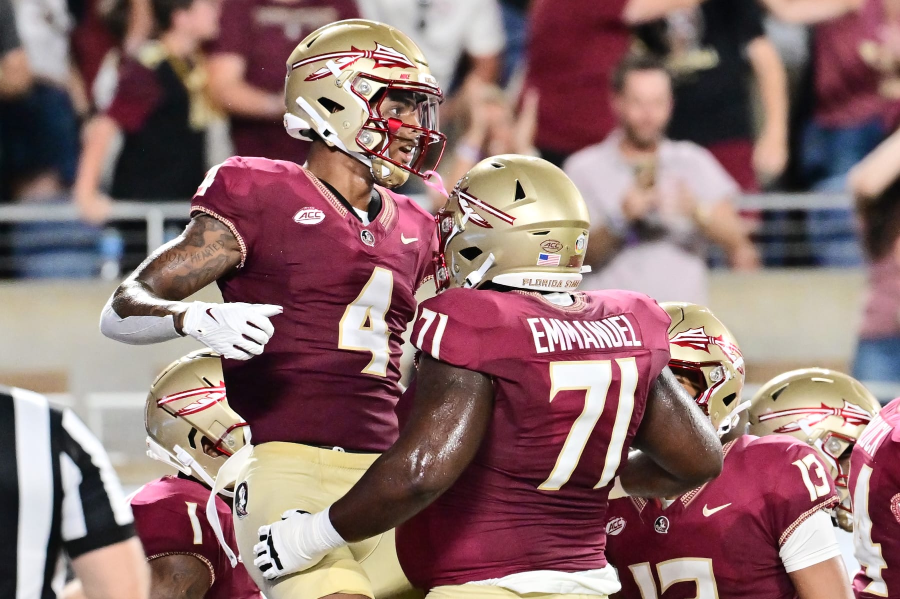ORLANDO, FLORIDA - SEPTEMBER 03: Keon Coleman #4 of the Florida State Seminoles celebrates with D'Mitri Emmanuel #71 after scoring in the first quarter against the LSU Tigers at Camping World Stadium on September 03, 2023 in Orlando, Florida. (Photo by Julio Aguilar/Getty Images)