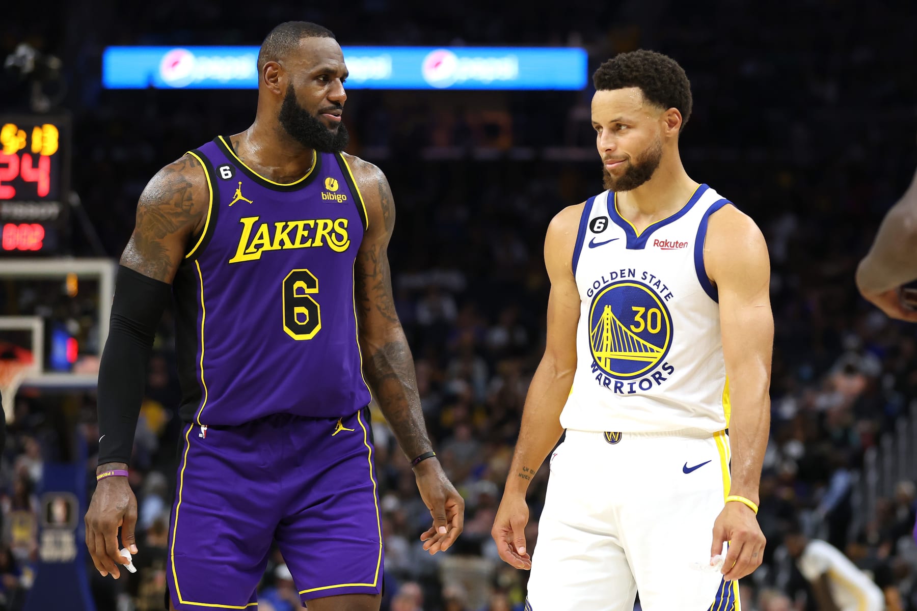 SAN FRANCISCO, CALIFORNIA - OCTOBER 18: LeBron James #6 of the Los Angeles Lakers speaks to Stephen Curry #30 of the Golden State Warriors during their game at Chase Center on October 18, 2022 in San Francisco, California. NOTE TO USER: User expressly acknowledges and agrees that, by downloading and or using this photograph, User is consenting to the terms and conditions of the Getty Images License Agreement. (Photo by Ezra Shaw/Getty Images)