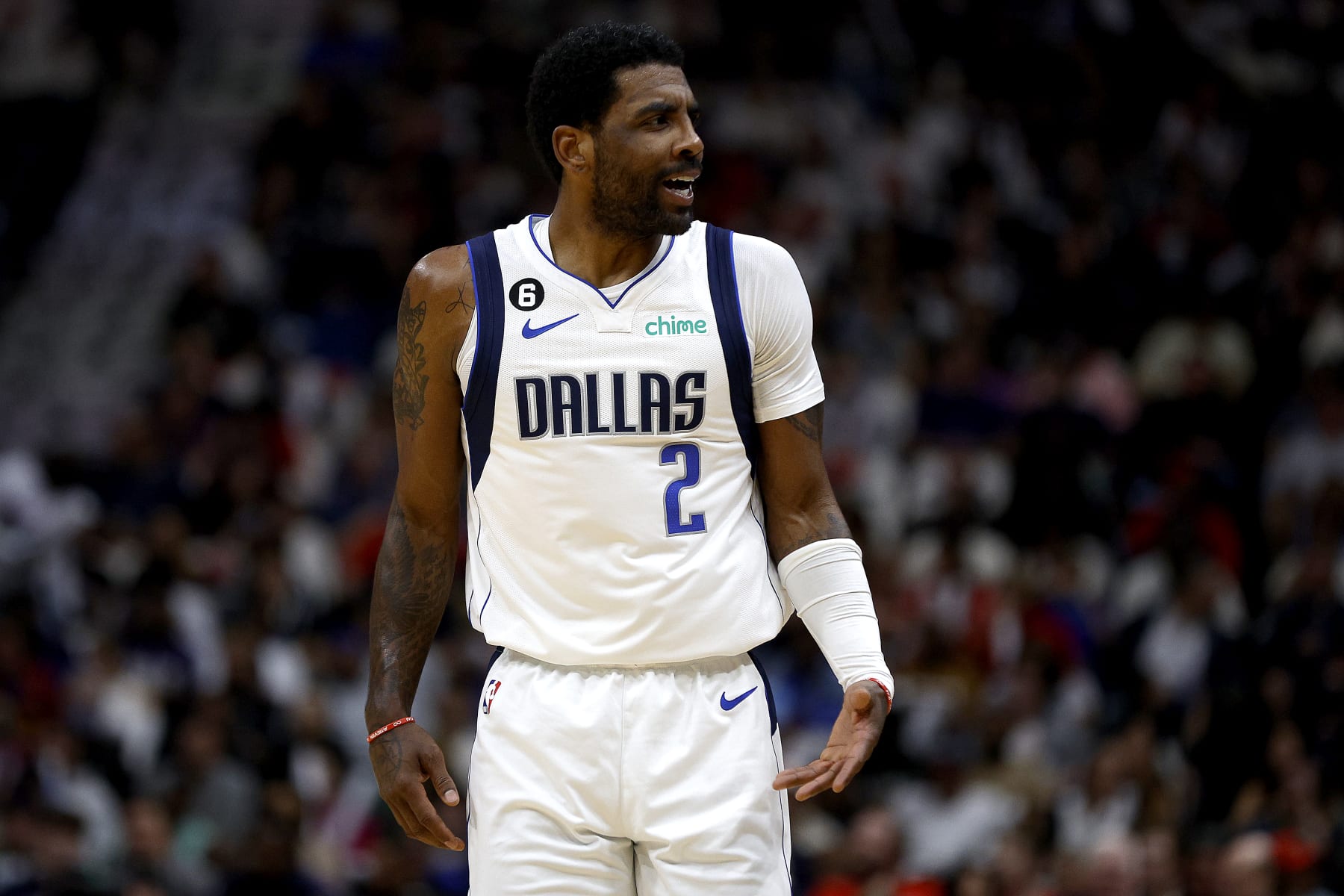 NEW ORLEANS, LOUISIANA - MARCH 08: Kyrie Irving #2 of the Dallas Mavericks reacts to a fan during the second quarter of an NBA game against the New Orleans Pelicans at Smoothie King Center on March 08, 2023 in New Orleans, Louisiana. NOTE TO USER: User expressly acknowledges and agrees that, by downloading and or using this photograph, User is consenting to the terms and conditions of the Getty Images License Agreement. (Photo by Sean Gardner/Getty Images)