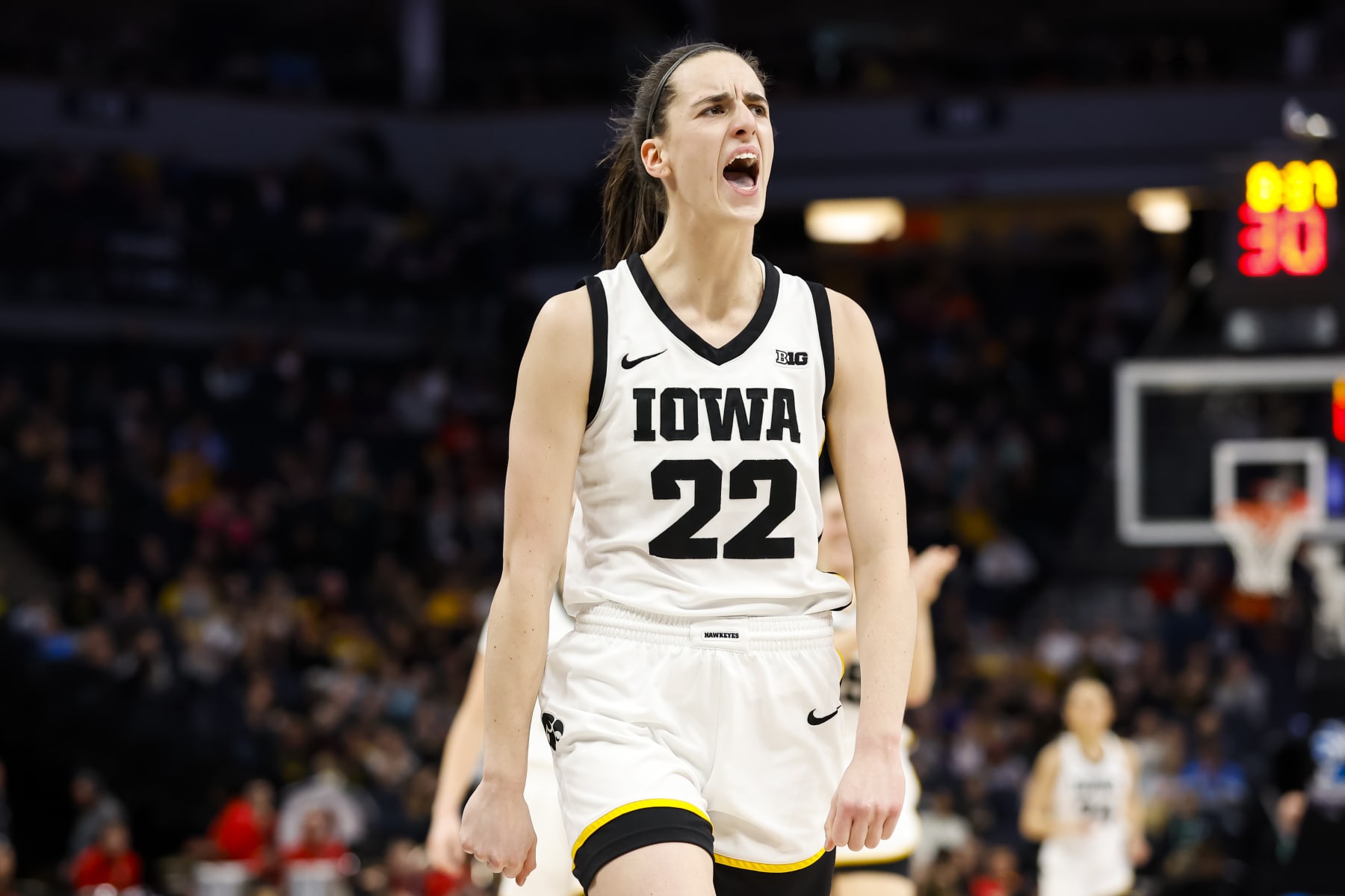 MINNEAPOLIS, MN - MARCH 05: Caitlin Clark #22 of the Iowa Hawkeyes celebrates her three-point basket against the Ohio State Buckeyes in the first half of the championship game of the Big Ten Women's Basketball Tournament at Target Center on March 5, 2023 in Minneapolis, Minnesota. (Photo by David Berding/Getty Images)