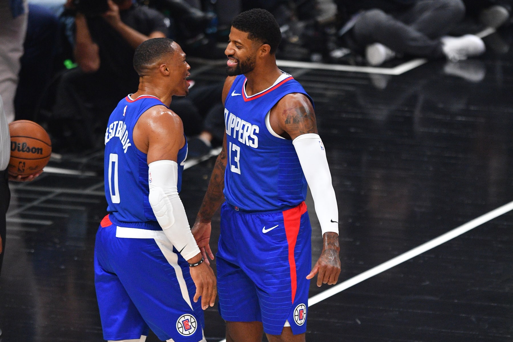 LOS ANGELES, CA - OCTOBER 25: Los Angeles Clippers guard Russell Westbrook (0) celebrates with Los Angeles Clippers guard Paul George (13) after a dunk during a NBA game between the Denver Nuggets and the Portland Trail Blazers on October 25, 2023 at Crypto.com Arena in Los Angeles, CA. (Photo by Brian Rothmuller/Icon Sportswire via Getty Images)