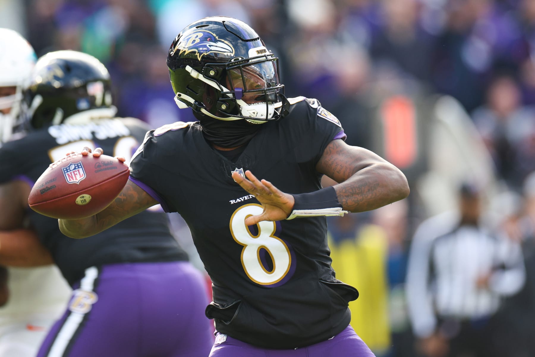 BALTIMORE, MARYLAND - DECEMBER 31: Lamar Jackson #8 of the Baltimore Ravens throws a pass against the Miami Dolphins during the first quarter of the game at M&T Bank Stadium on December 31, 2023 in Baltimore, Maryland. (Photo by Rob Carr/Getty Images)