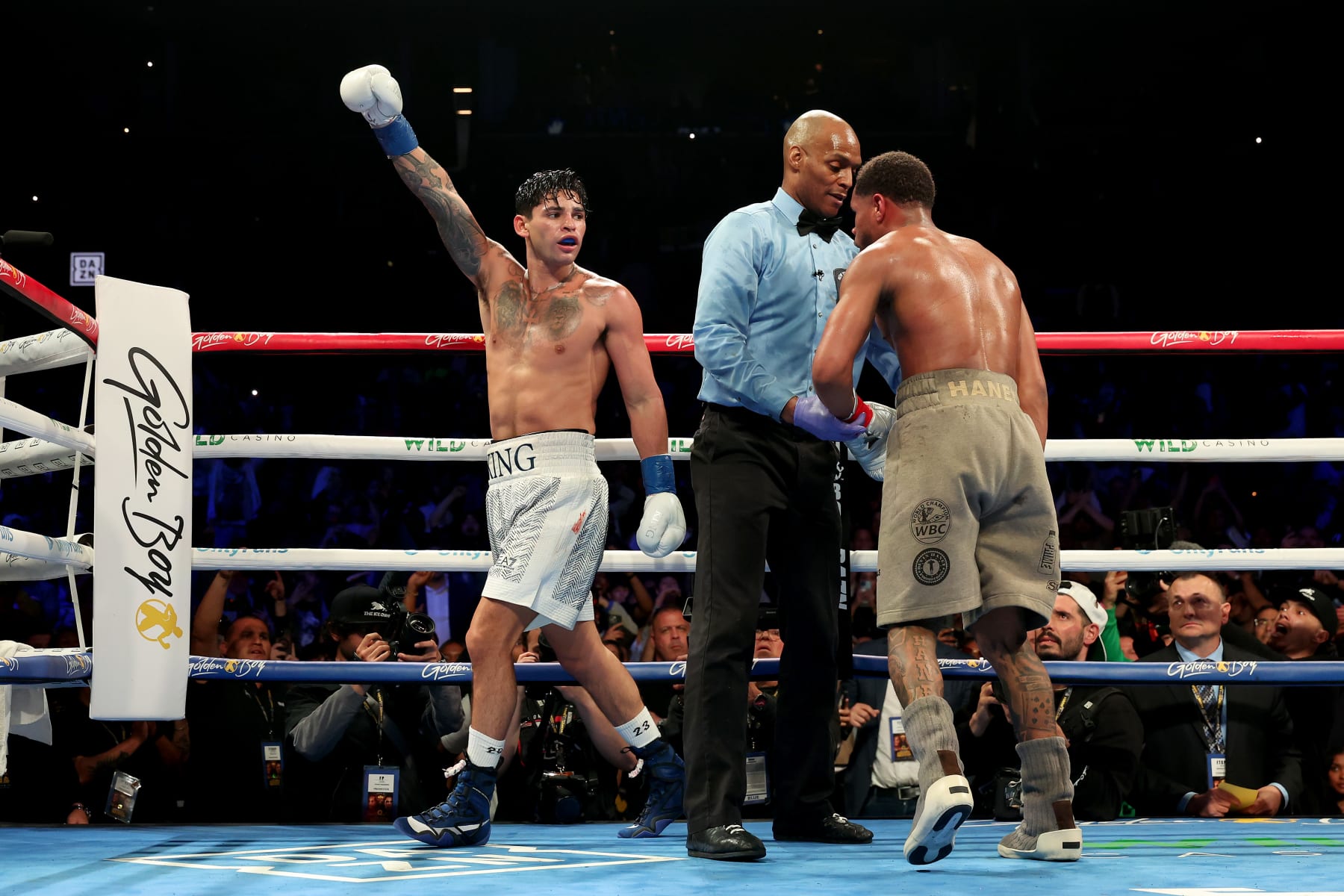 NEW YORK, NEW YORK - APRIL 20: Ryan Garcia (white trunks) celebrates after knocking down Devin Haney (gray trunks) during their WBC Super Lightweight title bout at Barclays Center on April 20, 2024 in New York City.  (Photo by Al Bello/Getty Images)