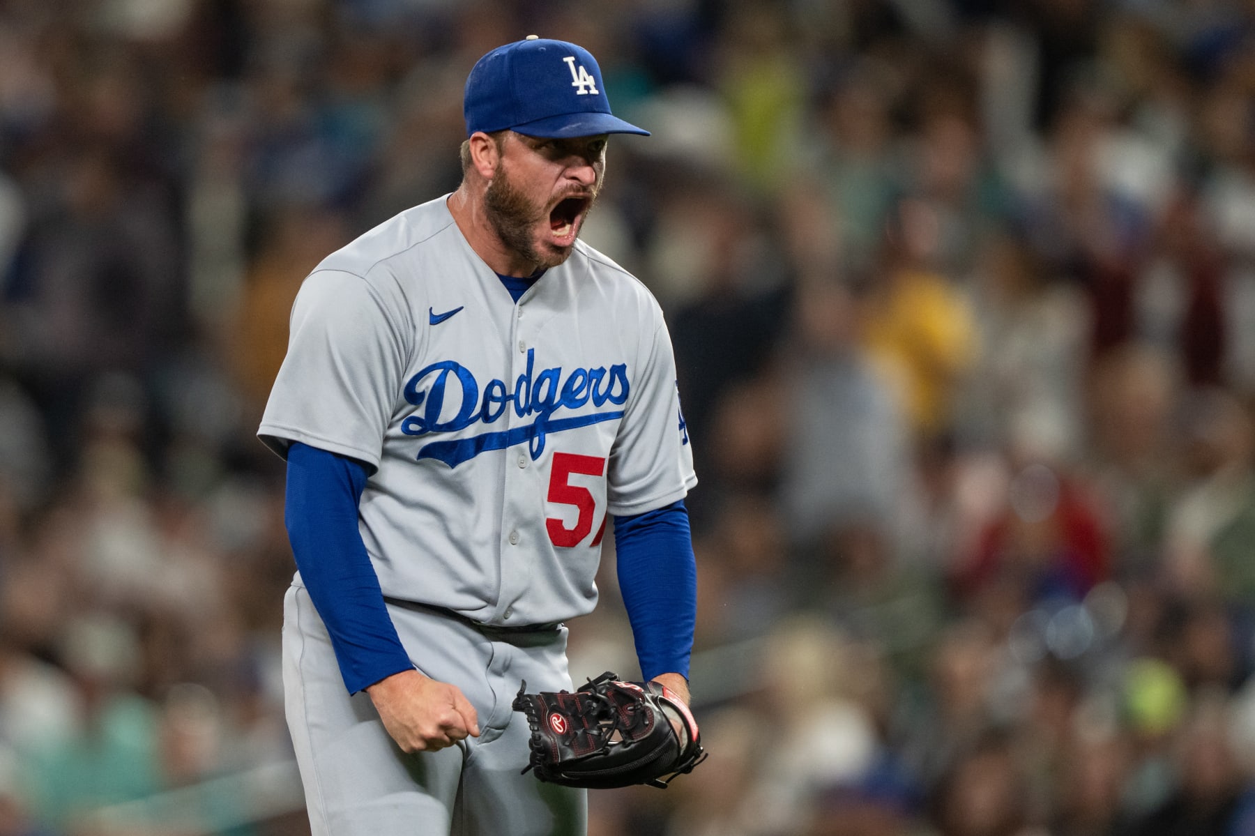 SEATTLE, WA - SEPTEMBER 16: Relief pitcher Ryan Brasier #57 of the Los Angeles Dodgers reacts after the final out of the eighth inning against the Seattle Mariners at T-Mobile Park on September 16, 2023 in Seattle, Washington. (Photo by Stephen Brashear/Getty Images)
