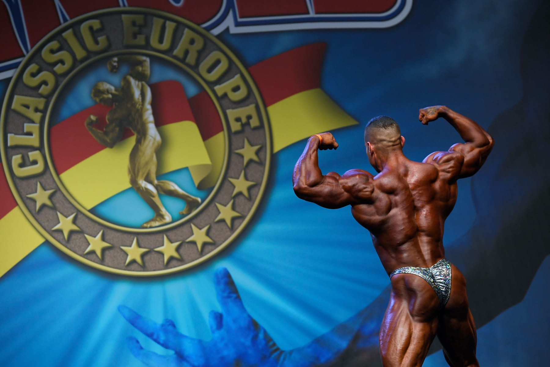 A bodybuilder flexes his muscles for the judges during the Arnold Classic Europe 2019 bodybuilding competition in Barcelona on September 21, 2019. (Photo by LLUIS GENE / AFP)        (Photo credit should read LLUIS GENE/AFP via Getty Images)
