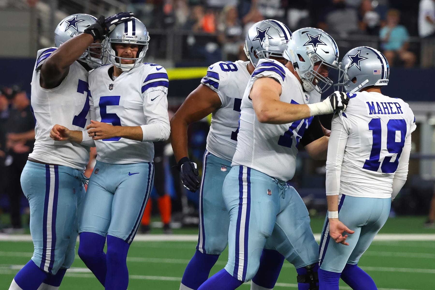 ARLINGTON, TEXAS - SEPTEMBER 18: Brett Maher #19 of the Dallas Cowboys is congratulated by Matt Waletzko #79 after making a game-winning field goal against the Cincinnati Bengals during the fourth quarter at AT&T Stadium on September 18, 2022 in Arlington, Texas. (Photo by Richard Rodriguez/Getty Images)