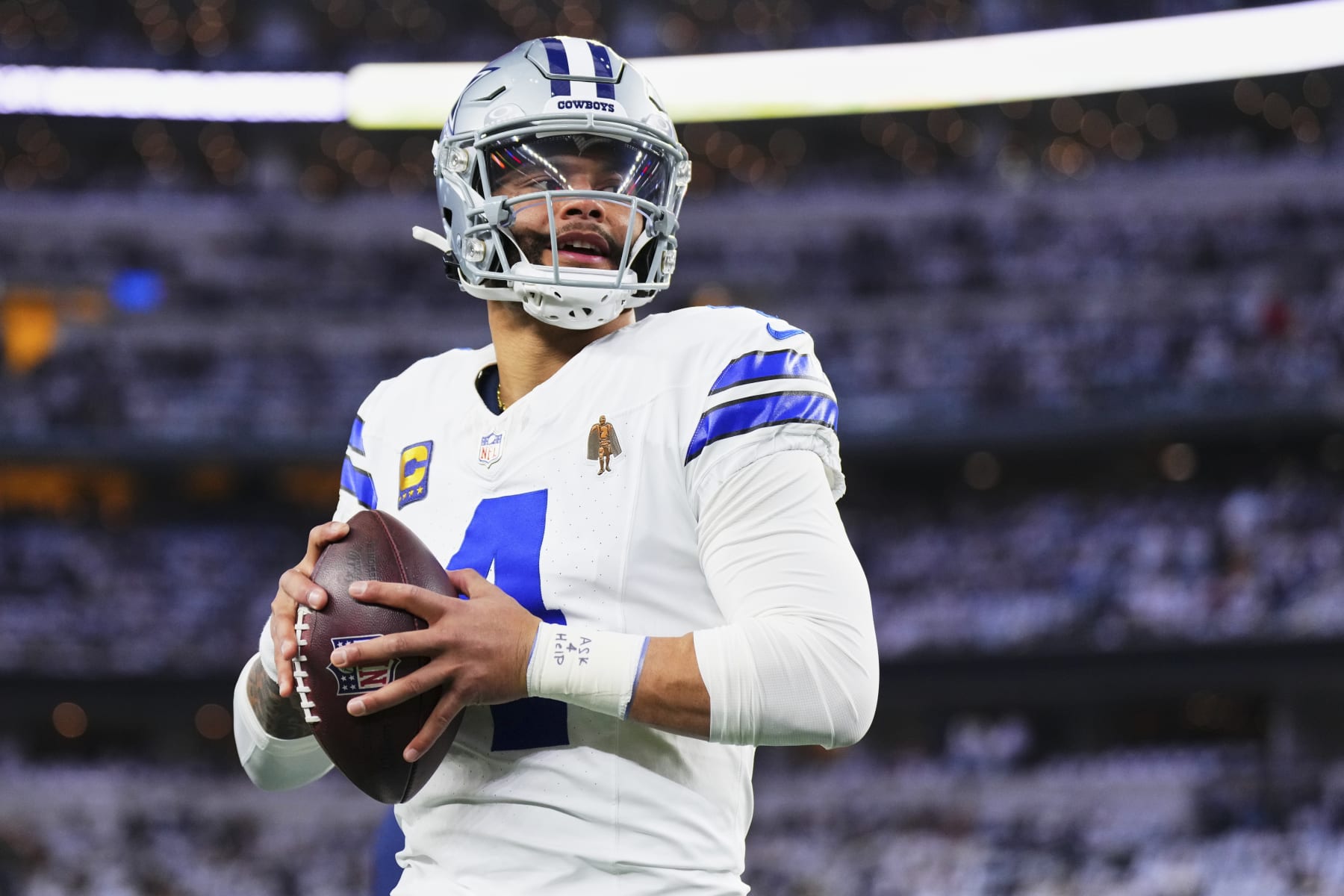 DALLAS, TX - JANUARY 14: Dak Prescott #4 of the Dallas Cowboys warms up before kickoff against the Green Bay Packers during the NFC Wild Card playoff game at AT&T Stadium on January 14, 2024 in Dallas, Texas. (Photo by Cooper Neill/Getty Images) DALLAS, TX - JANUARY 14: Dak Prescott #4 of the Dallas Cowboys warms up before kickoff against the Green Bay Packers during the NFC Wild Card playoff game at AT&T Stadium on January 14, 2024 in Dallas, Texas. (Photo by Cooper Neill/Getty Images)