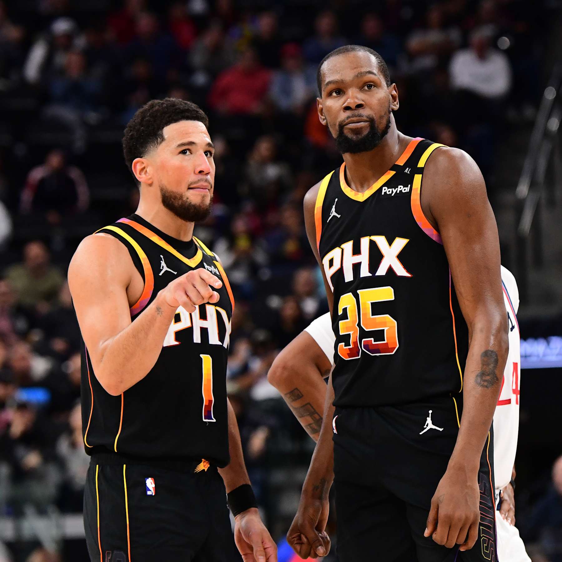 INGLEWOOD, CA - OCTOBER 31: Devin Booker #1 and Kevin Durant #35 of the Phoenix Suns talk during the game against the LA Clippers on October 31, 2024 at Intuit Dome in Los Angeles, California. NOTE TO USER: User expressly acknowledges and agrees that, by downloading and/or using this Photograph, user is consenting to the terms and conditions of the Getty Images License Agreement. Mandatory Copyright Notice: Copyright 2024 NBAE (Photo by Adam Pantozzi/NBAE via Getty Images)