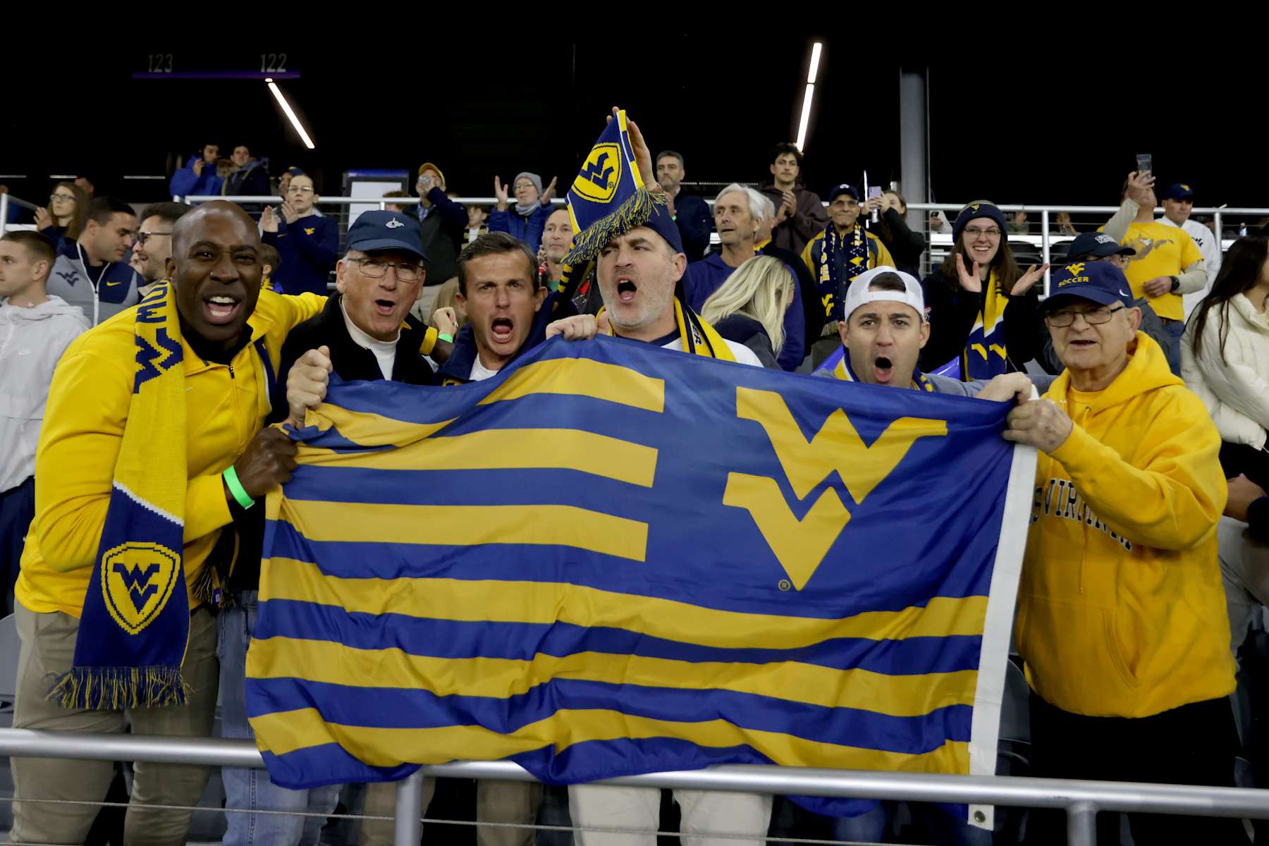 LOUISVILLE, KENTUCKY - DECEMBER 8: West Virginia Mountaineers fans cheer against the Clemson Tigers during the Division I Men's Soccer Semifinals held at the Lynn Family Stadium on December 8, 2023 in Louisville, Kentucky. (Photo by Michelle Hutchins/NCAA Photos via Getty Images)