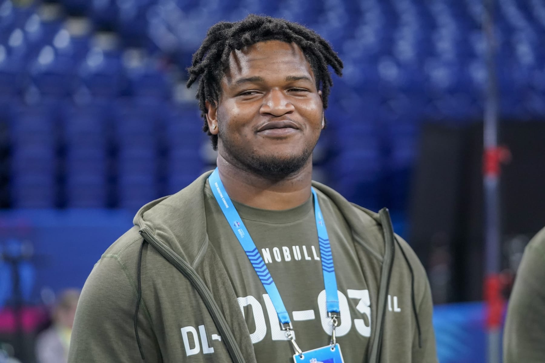 Georgia defensive lineman Jalen Carter watches as players warm up on the field before the NFL football scouting combine in Indianapolis, Thursday, March 2, 2023. (AP Photo/Darron Cummings)
