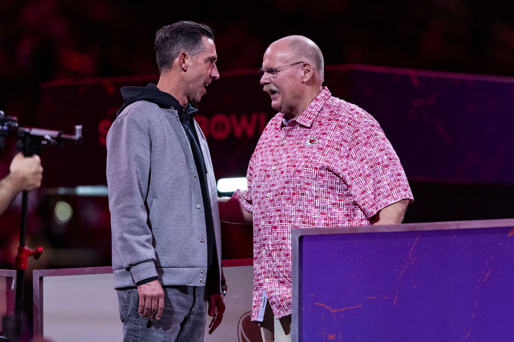 LAS VEGAS, NEVADA - FEBRUARY 5: San Francisco 49ers head coach Kyle Shanahan talks to Kansas City Chiefs head coach Andy Reid during Opening Night at Allegiant Stadium on February 5, 2024 in Las Vegas, Nevada. (Photo by Lauren Leigh Bacho/Getty Images)