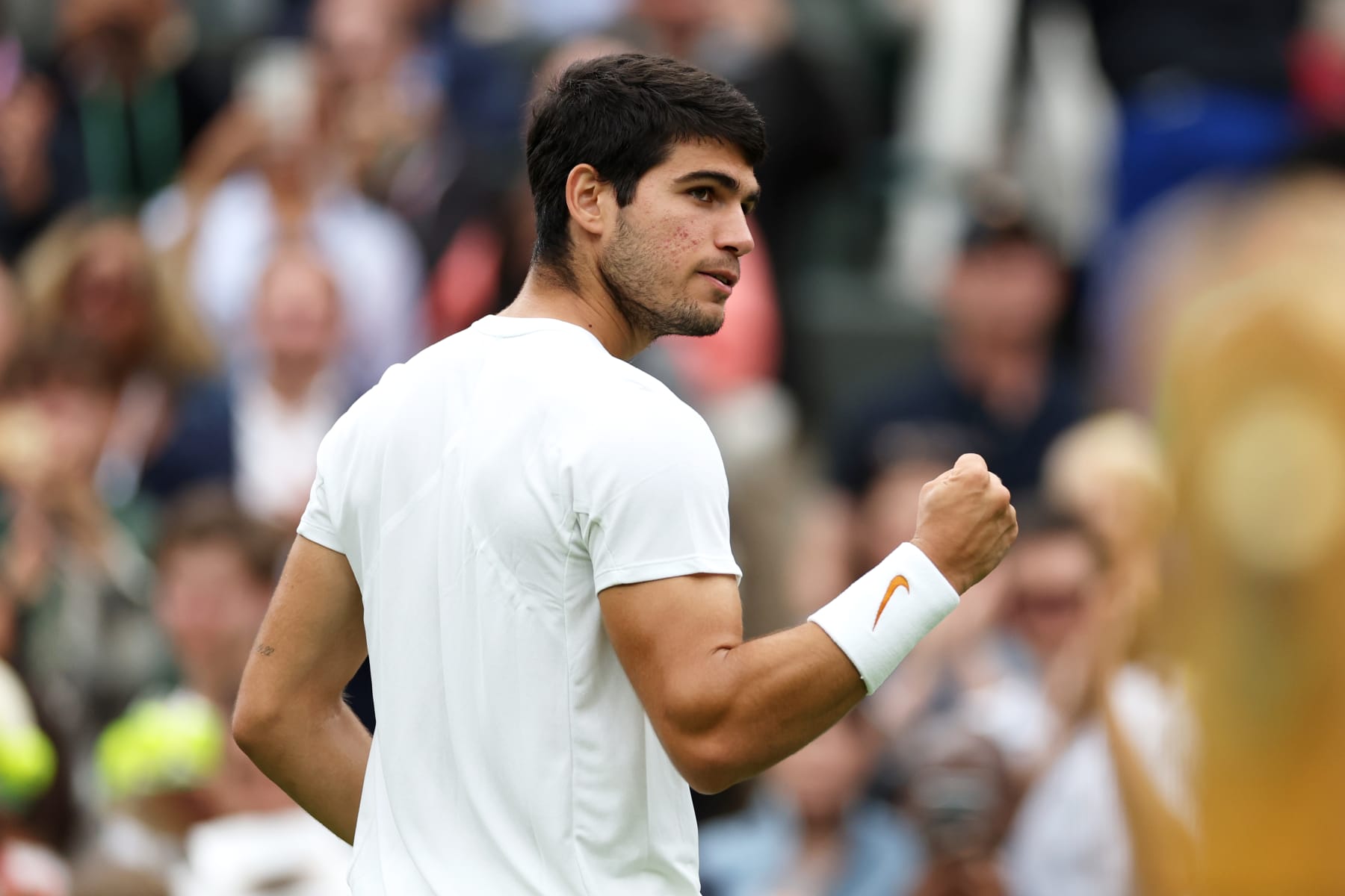 LONDON, ENGLAND - JULY 04: Carlos Alcaraz of Spain celebrates winning match point against Jeremy Chardy of France in the Men's Singles first round match during day two of The Championships Wimbledon 2023 at All England Lawn Tennis and Croquet Club on July 04, 2023 in London, England. (Photo by Michael Regan/Getty Images)