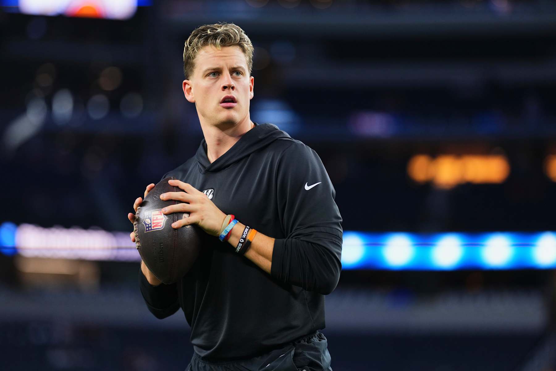ARLINGTON, TX - DECEMBER 09: Joe Burrow #9 of the Cincinnati Bengals warms up before kickoff of an NFL football game against the Dallas Cowboys at AT&T Stadium on December 9, 2024 in Arlington, Texas. (Photo by Cooper Neill/Getty Images)