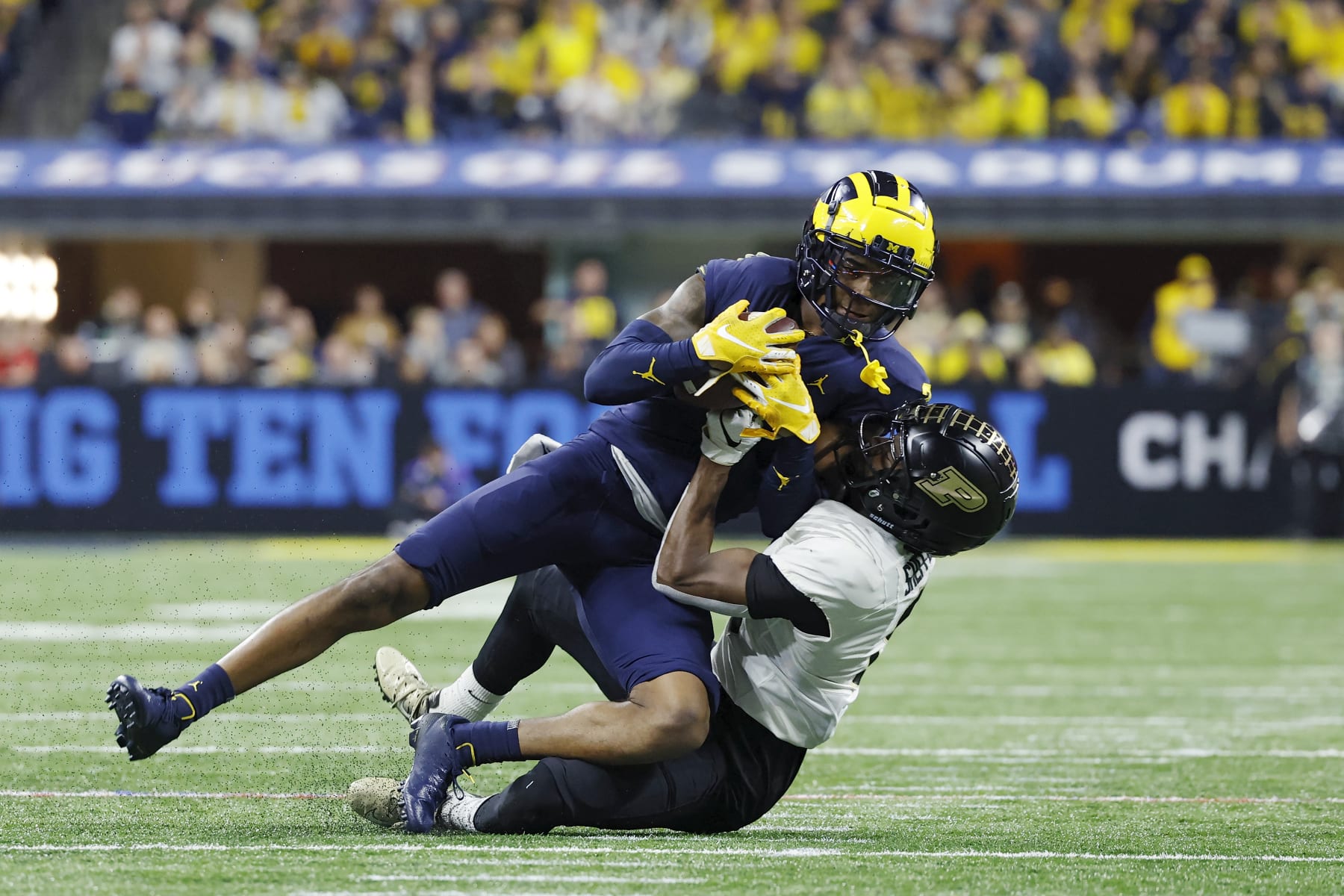 INDIANAPOLIS, IN - DECEMBER 03: Michigan Wolverines defensive back Will Johnson (2) makes his second interception during the Big 10 Championship college football game against the Purdue Boilermakers on December 3, 2022 at Lucas Oil Stadium in Indianapolis, Indiana. (Photo by Joe Robbins/Icon Sportswire via Getty Images)