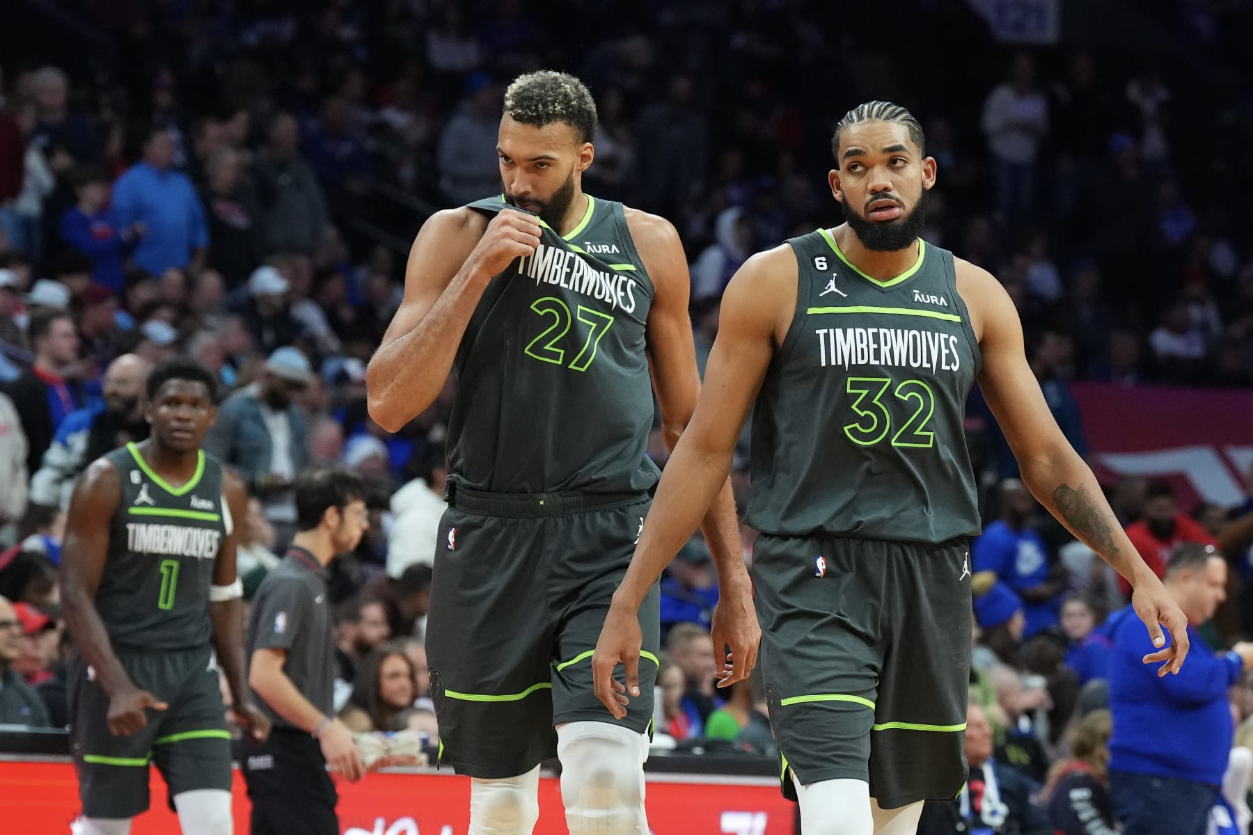 PHILADELPHIA, PA - NOVEMBER 19: Anthony Edwards #1, Rudy Gobert #27, and Karl-Anthony Towns #32 of the Minnesota Timberwolves look on against the Philadelphia 76ers at the Wells Fargo Center on November 19, 2022 in Philadelphia, Pennsylvania. NOTE TO USER: User expressly acknowledges and agrees that, by downloading and or using this photograph, User is consenting to the terms and conditions of the Getty Images License Agreement. (Photo by Mitchell Leff/Getty Images)