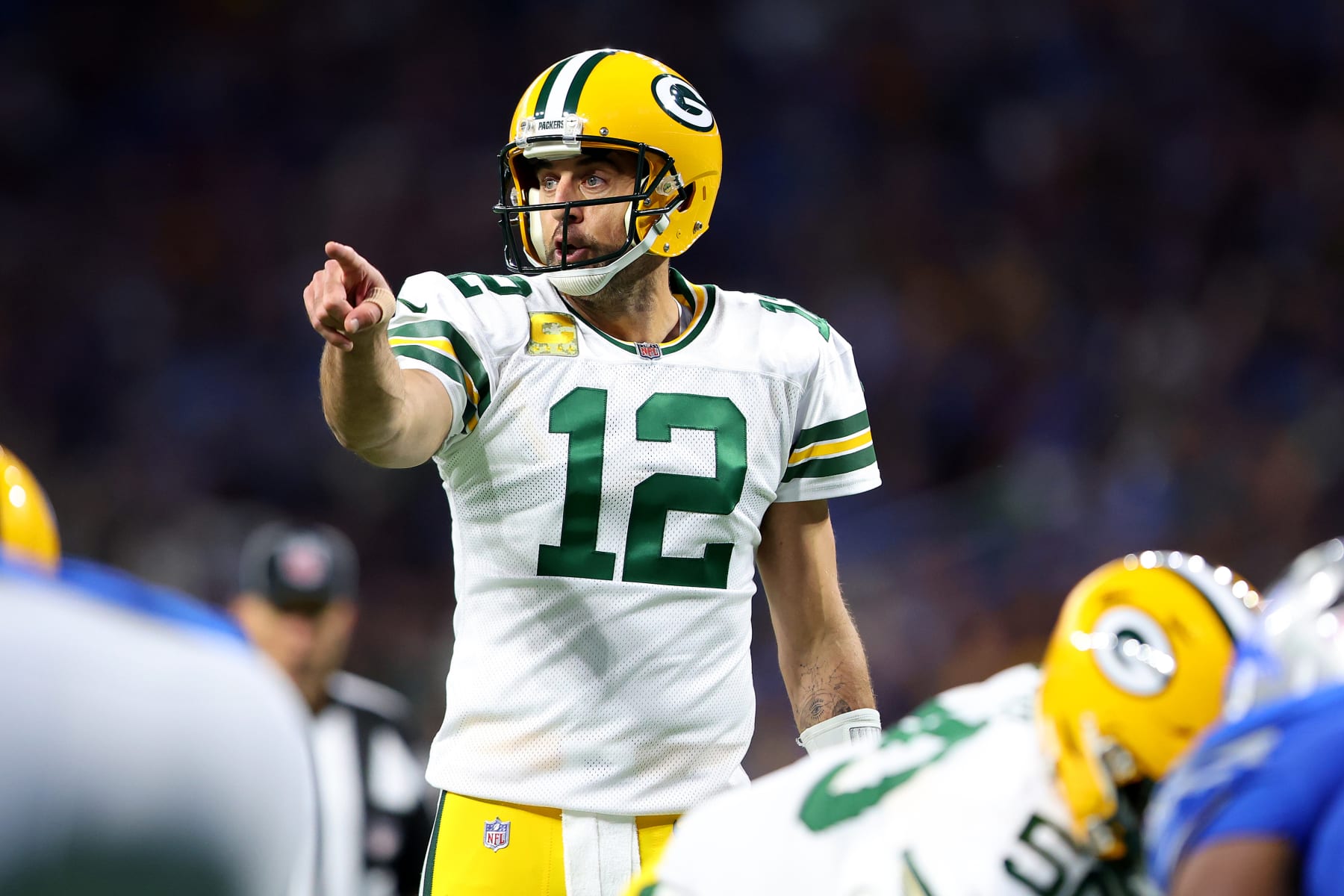 DETROIT, MICHIGAN - NOVEMBER 06: Aaron Rodgers #12 of the Green Bay Packers signals at the line of scrimmage against the Detroit Lions during the first half at Ford Field on November 06, 2022 in Detroit, Michigan. (Photo by Rey Del Rio/Getty Images)