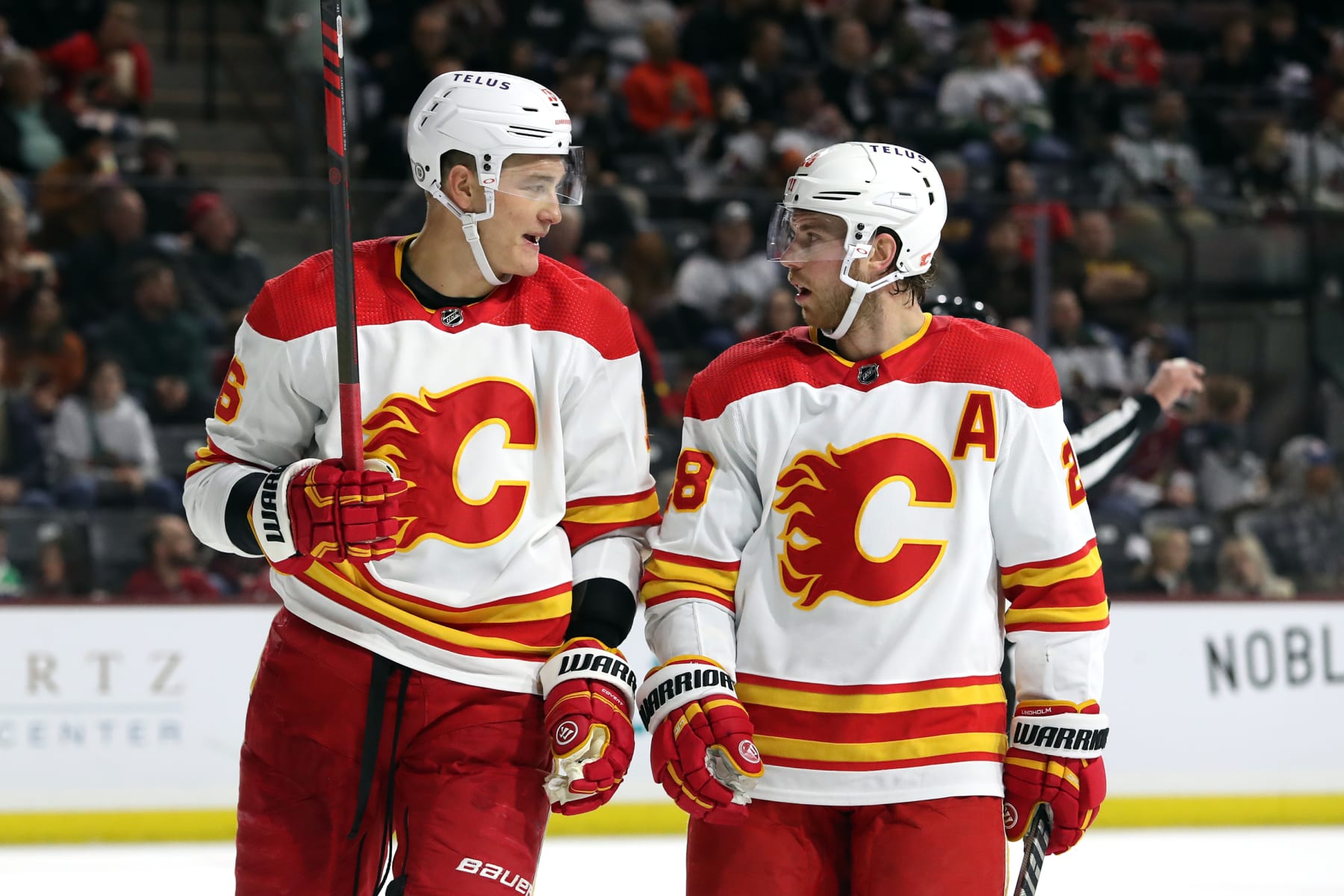 TEMPE, ARIZONA - FEBRUARY 22: Nikita Zadorov #16 of the Calgary Flames and Elias Lindholm #28 of the Calgary Flames before a faceoff against the Arizona Coyotes at Mullett Arena on February 22, 2023 in Tempe, Arizona. (Photo by Zac BonDurant/Getty Images)