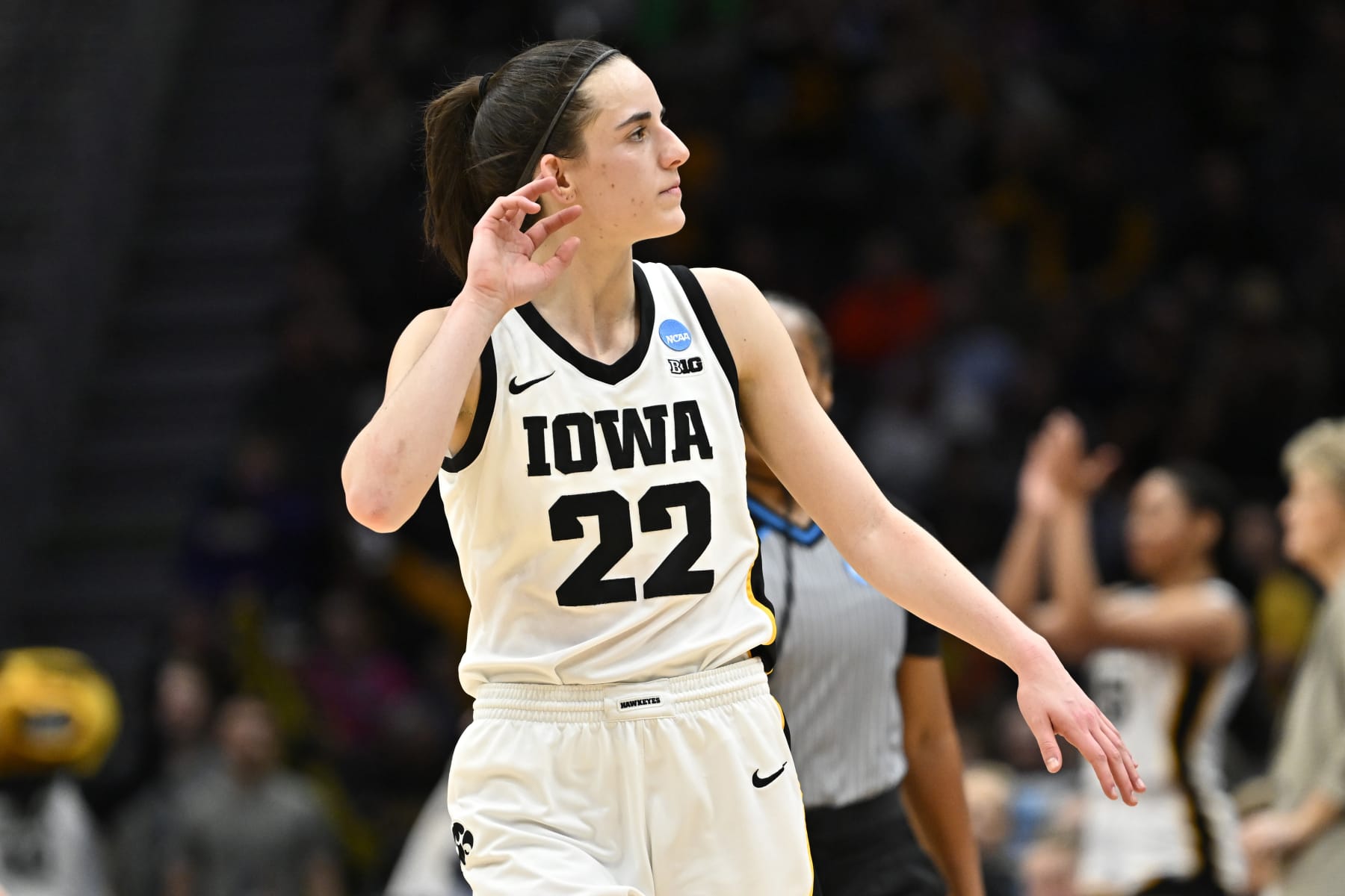 SEATTLE, WASHINGTON - MARCH 26: Caitlin Clark #22 of the Iowa Hawkeyes reacts during the fourth quarter of the game against the Louisville Cardinals in the Elite Eight round of the NCAA Women's Basketball Tournament at Climate Pledge Arena on March 26, 2023 in Seattle, Washington. (Photo by Alika Jenner/Getty Images)