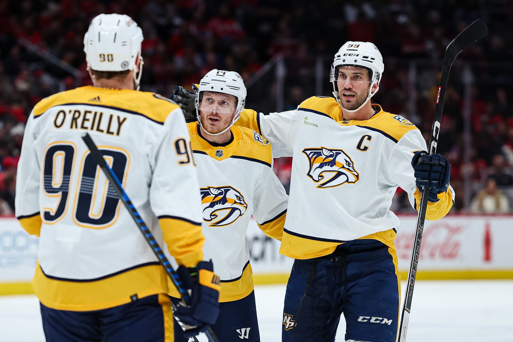 WASHINGTON, DC - DECEMBER 30: Roman Josi #59 of the Nashville Predators celebrates with Gustav Nyquist #14 and Ryan OReilly #90 after scoring a goal against the Washington Capitals during the first period of the game at Capital One Arena on December 30, 2023 in Washington, DC. (Photo by Scott Taetsch/Getty Images)