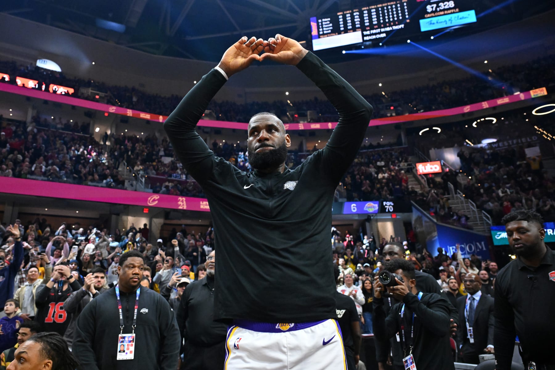CLEVELAND, OHIO - NOVEMBER 25: LeBron James #23 of the Los Angeles Lakers acknowledges the fans during a tribute video during the first quarter against the Cleveland Cavaliers at Rocket Mortgage Fieldhouse on November 25, 2023 in Cleveland, Ohio. NOTE TO USER: User expressly acknowledges and agrees that, by downloading and or using this photograph, User is consenting to the terms and conditions of the Getty Images License Agreement. (Photo by Jason Miller/Getty Images)