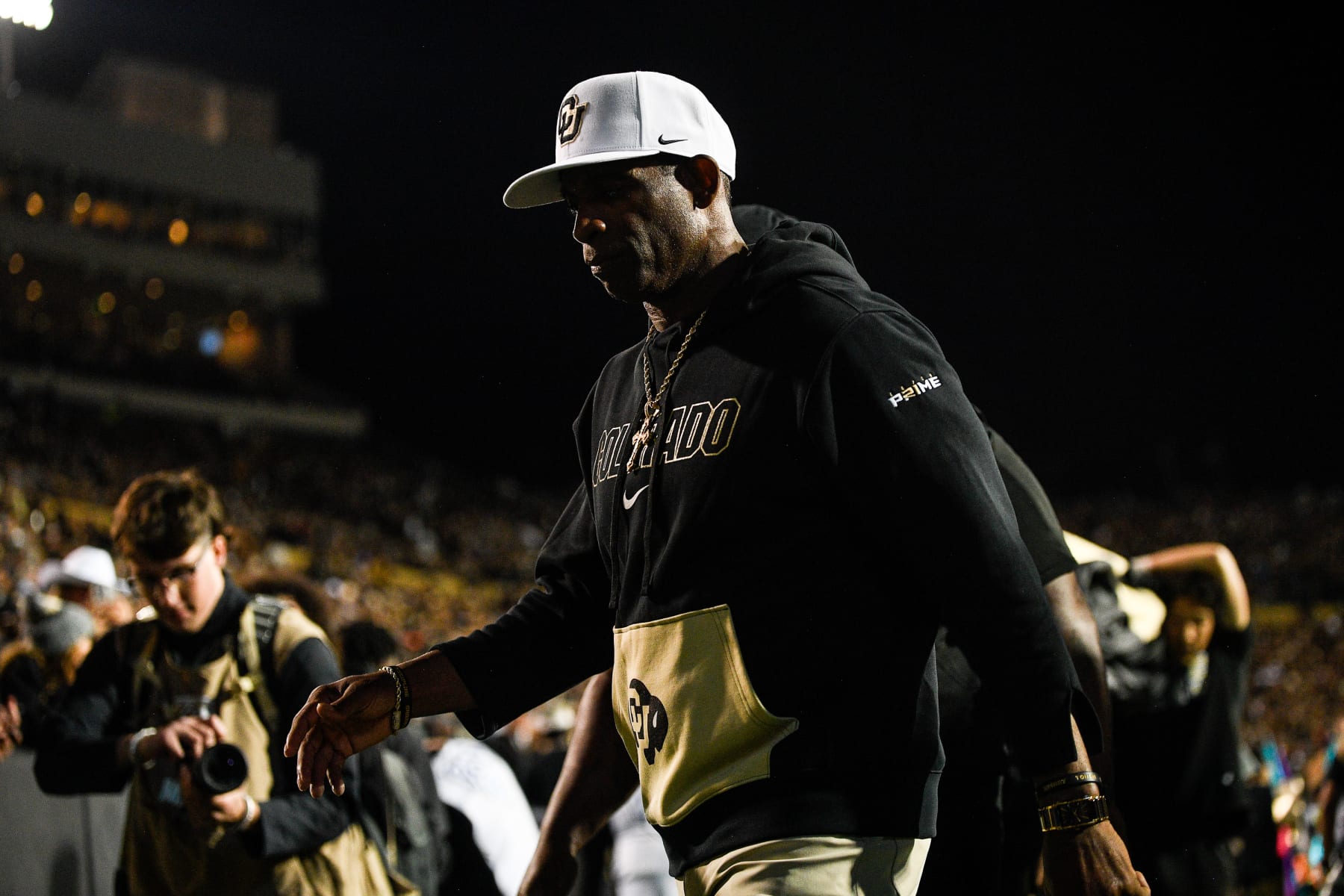 BOULDER, CO - SEPTEMBER 16:  Head coach Deion Sanders of the Colorado Buffaloes walks off the field at halftime of a game against the Colorado State Rams at Folsom Field on September 16, 2023 in Boulder, Colorado. (Photo by Dustin Bradford/Getty Images)