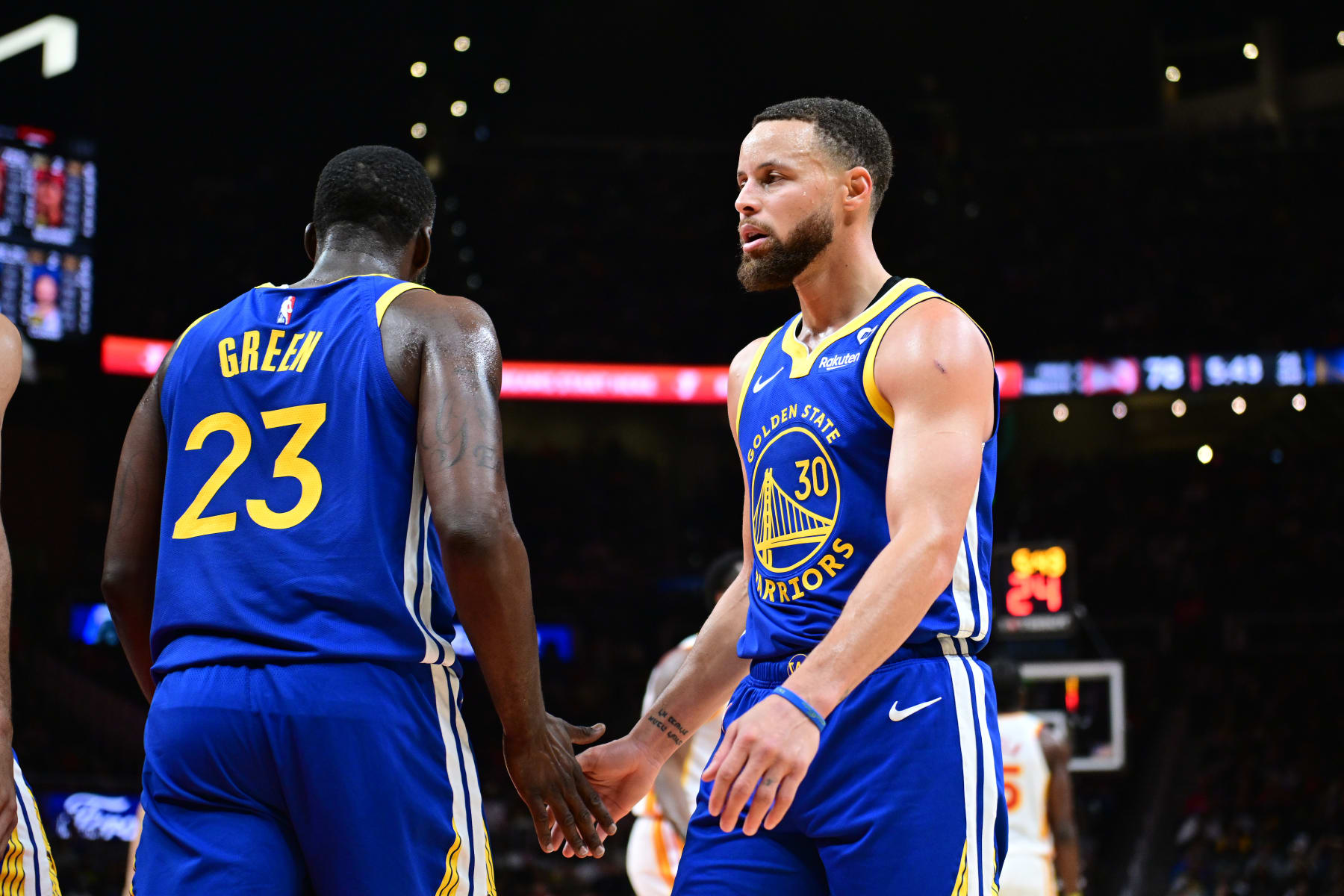 ATLANTA, GA - FEBRUARY 3: Draymond Green #23 high fives Stephen Curry #30 of the Golden State Warriors during the game against the Atlanta Hawks on February 3, 2024 at State Farm Arena in Atlanta, Georgia.  NOTE TO USER: User expressly acknowledges and agrees that, by downloading and/or using this Photograph, user is consenting to the terms and conditions of the Getty Images License Agreement. Mandatory Copyright Notice: Copyright 2024 NBAE (Photo by Adam Hagy/NBAE via Getty Images)