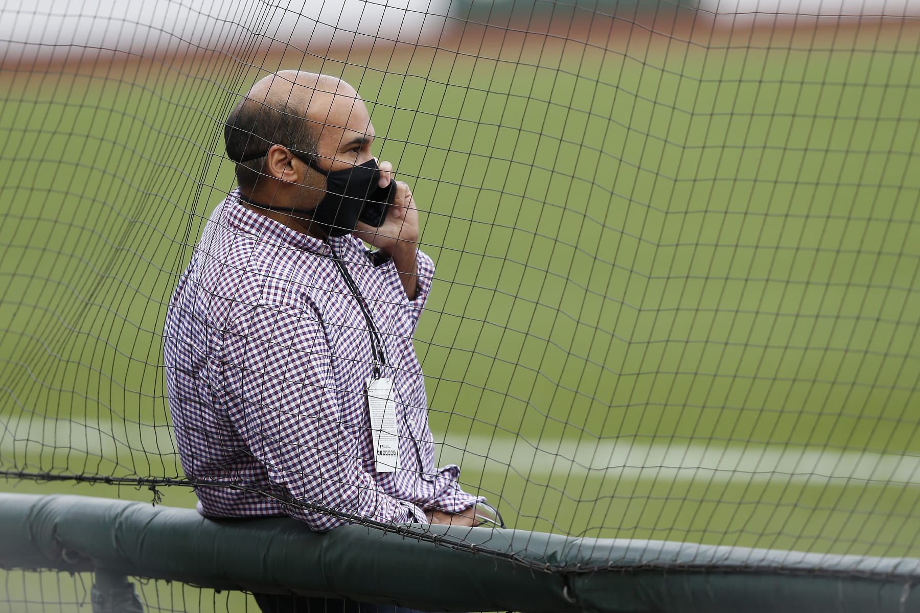 SAN FRANCISCO, CALIFORNIA - AUGUST 26: President of Baseball Operations Farhan Zaidi of the San Francisco Giants talks on the phone before the postponement of the game against the Los Angeles Dodgers at Oracle Park on August 26, 2020 in San Francisco, California. Several sporting leagues across the nation today are postponing their schedules as players protest the shooting of Jacob Blake by Kenosha, Wisconsin police. (Photo by Lachlan Cunningham/Getty Images)